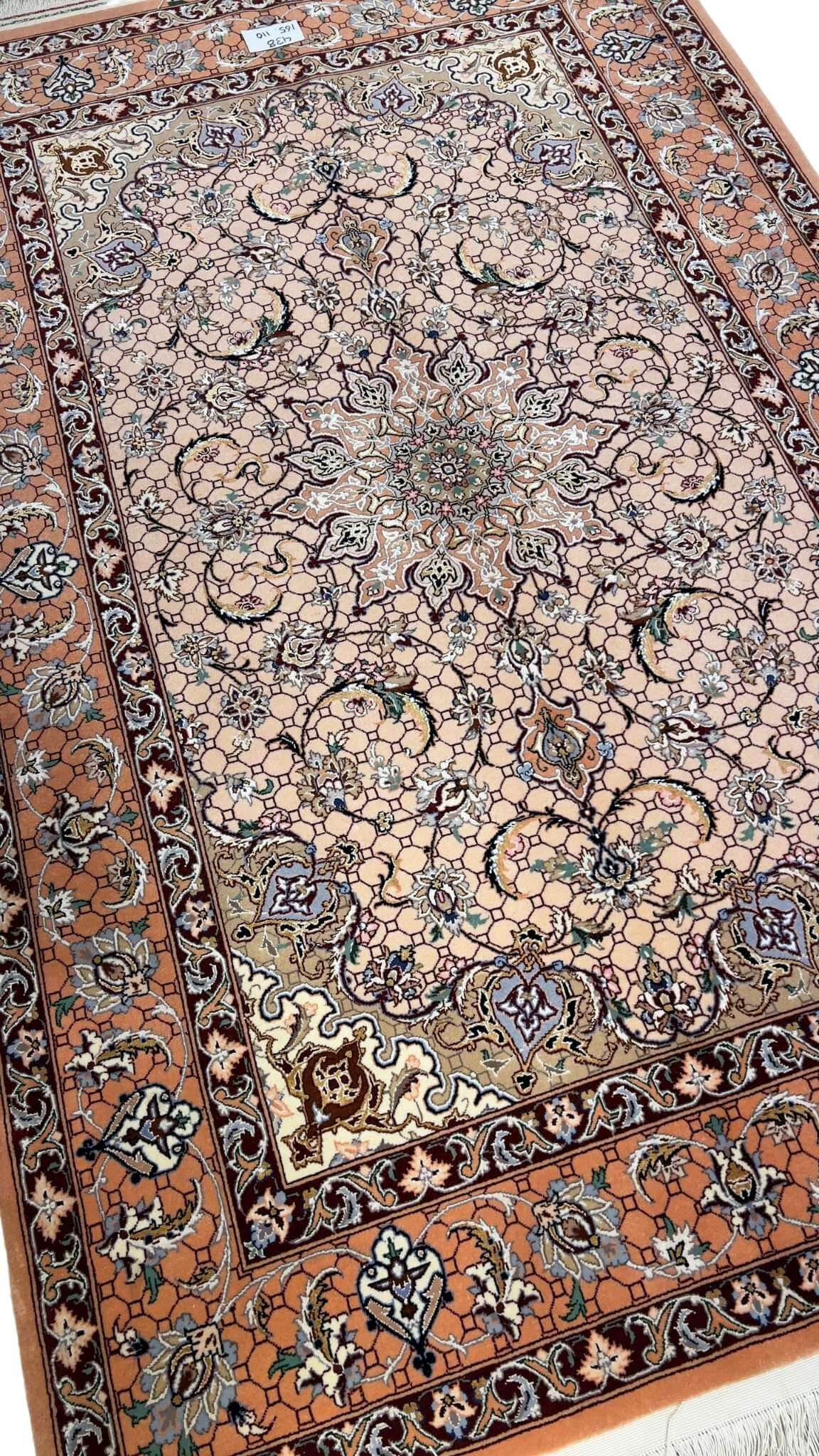 Premium Persian carpet with a wool and silk blend from master weaver Davarie.
