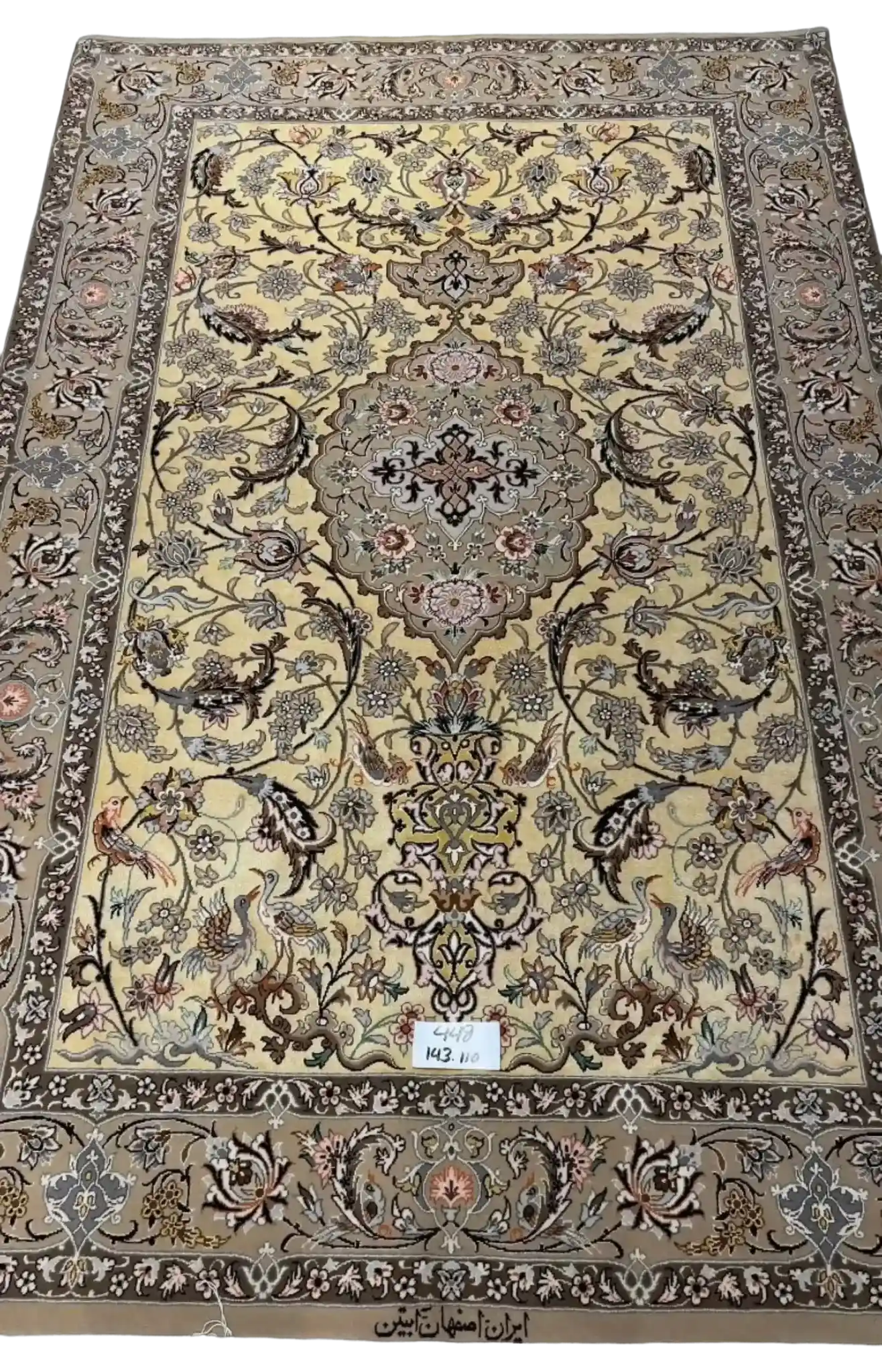 "Hand-knotted Persian rug made from wool and silk, showcasing traditional Isfahan design. Size: 143 cm x 110 cm. Knot density of 810,000 knots/m². Perfect for adding elegance to any living space."