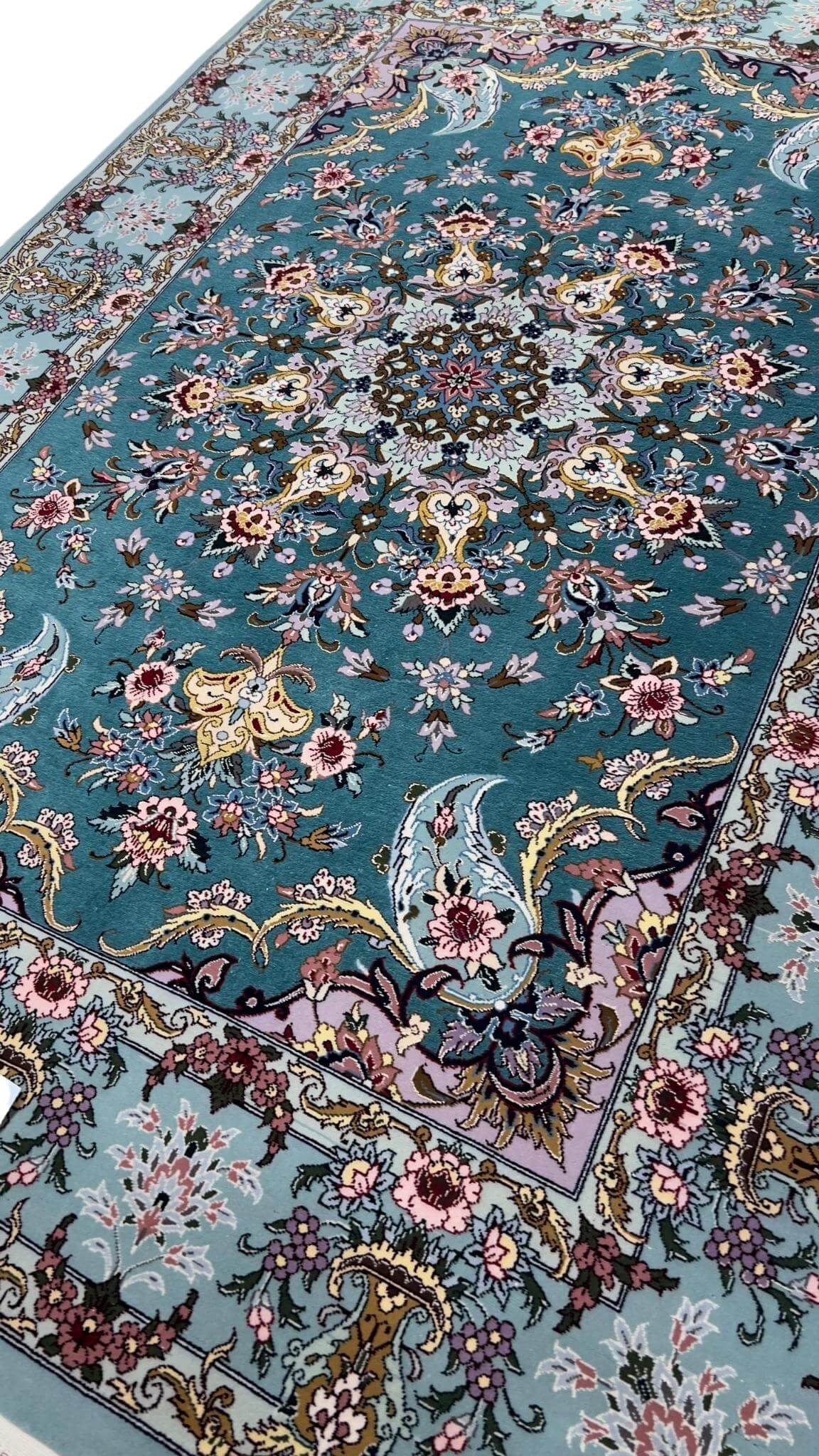Handmade Persian rug from Isfahan with intricate floral patterns.
