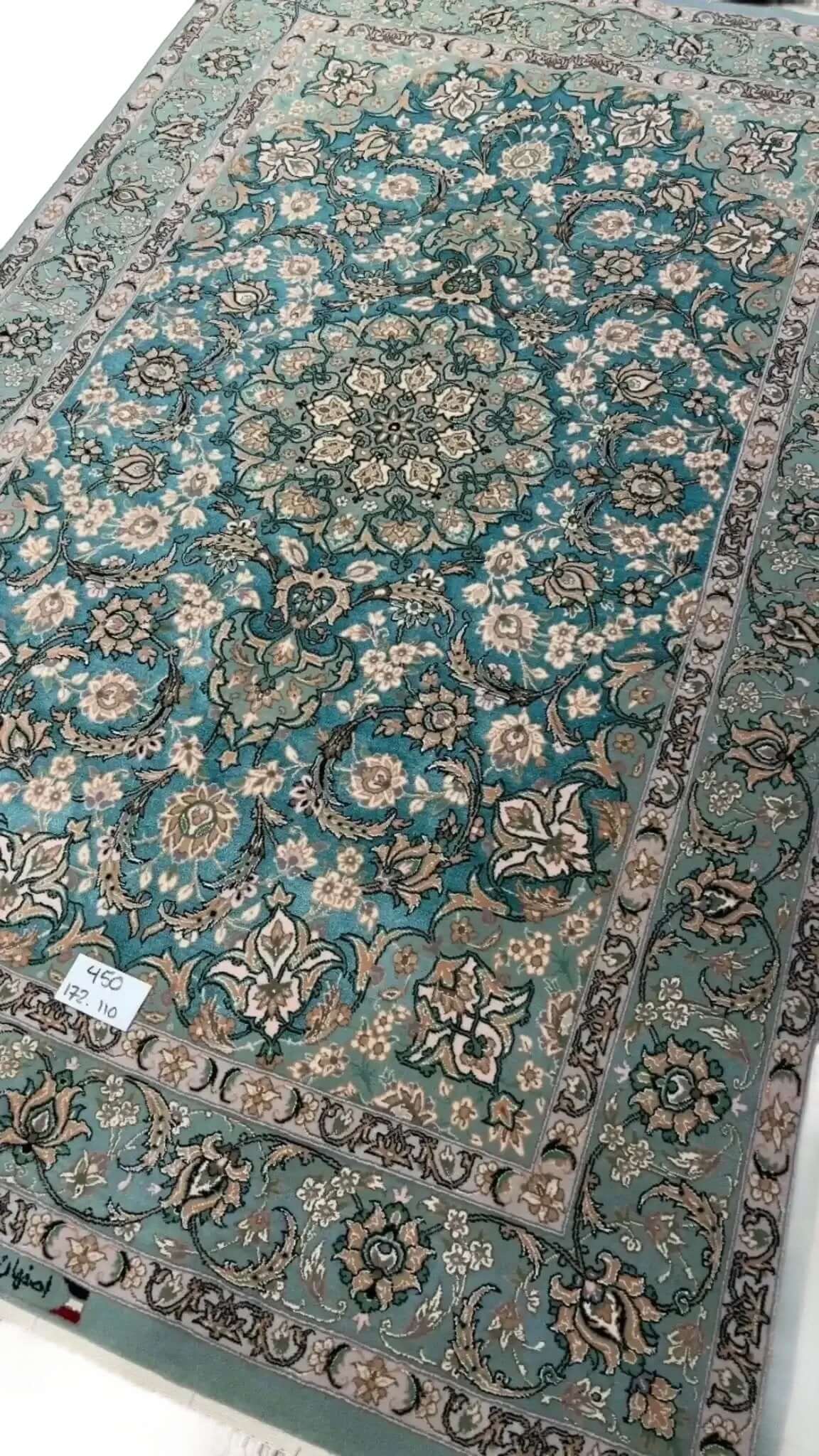 "Exquisite Isfahan handmade rug with silk and wool blend, showcasing a traditional Persian medallion motif."