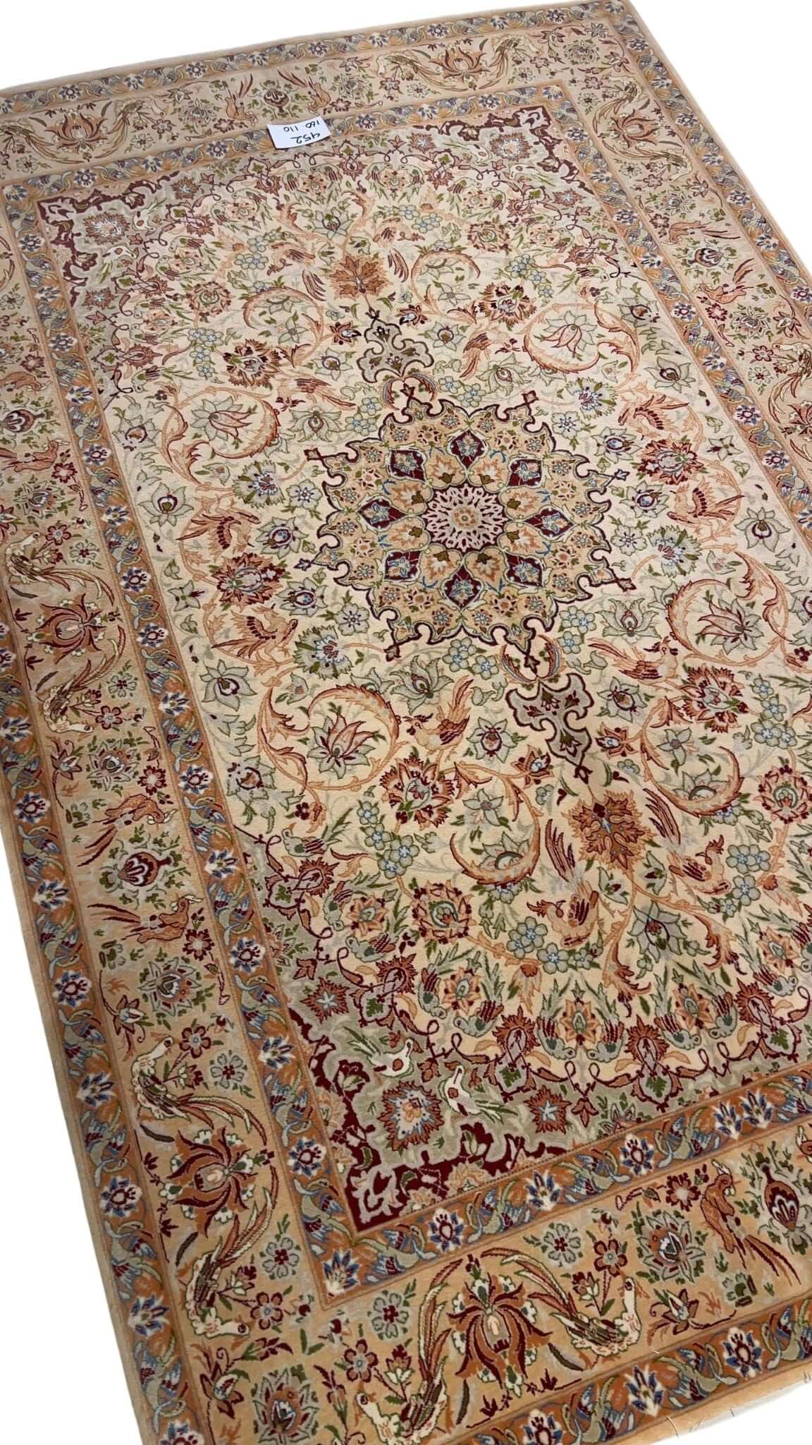 "60-year-old Persian rug featuring detailed silk and wool craftsmanship."
