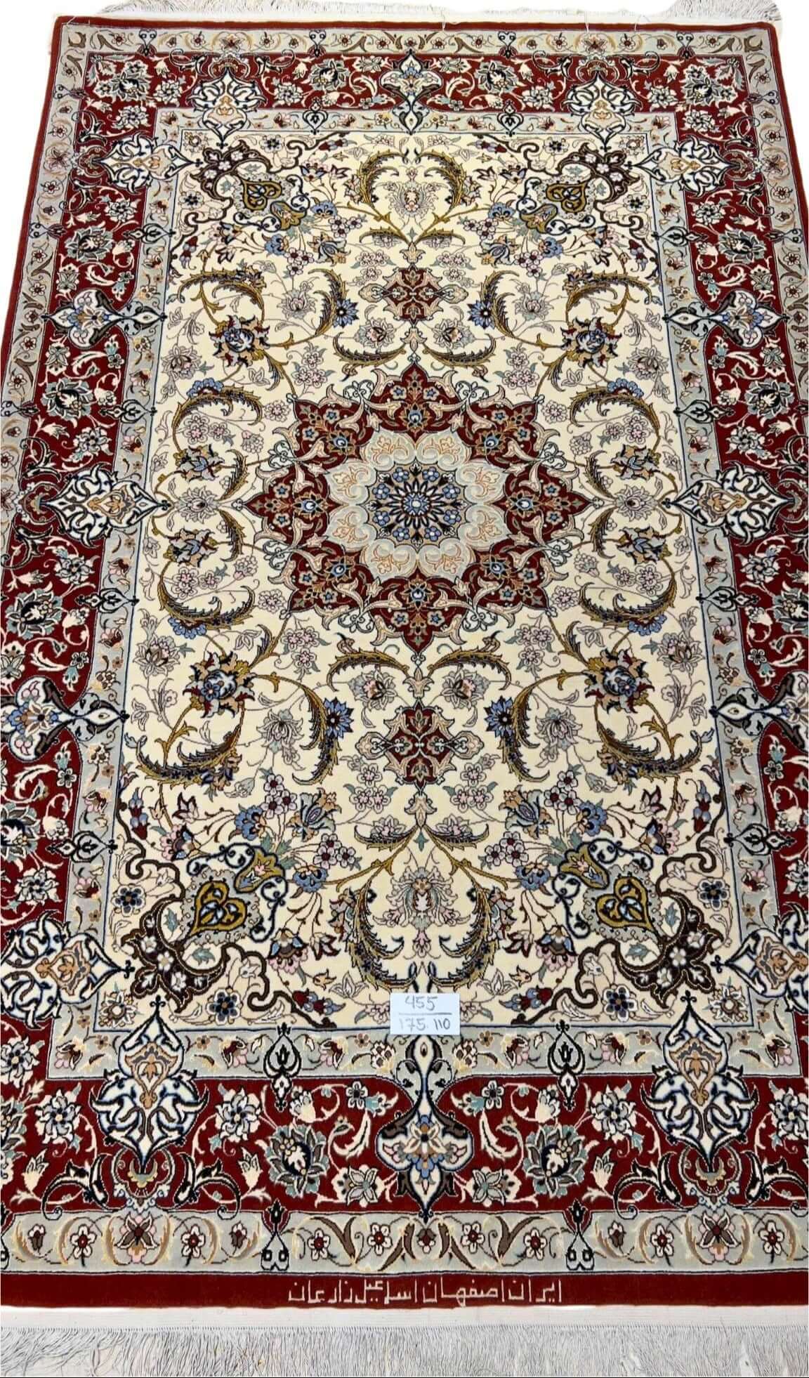 "Hand-knotted Isfahan rug featuring floral designs, crafted with wool and silk."
