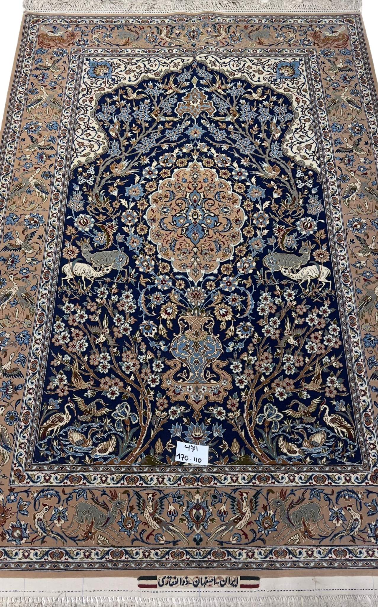 Close-up view of the fine craftsmanship on the Limited Edition Persian Rug with blue and brown motifs