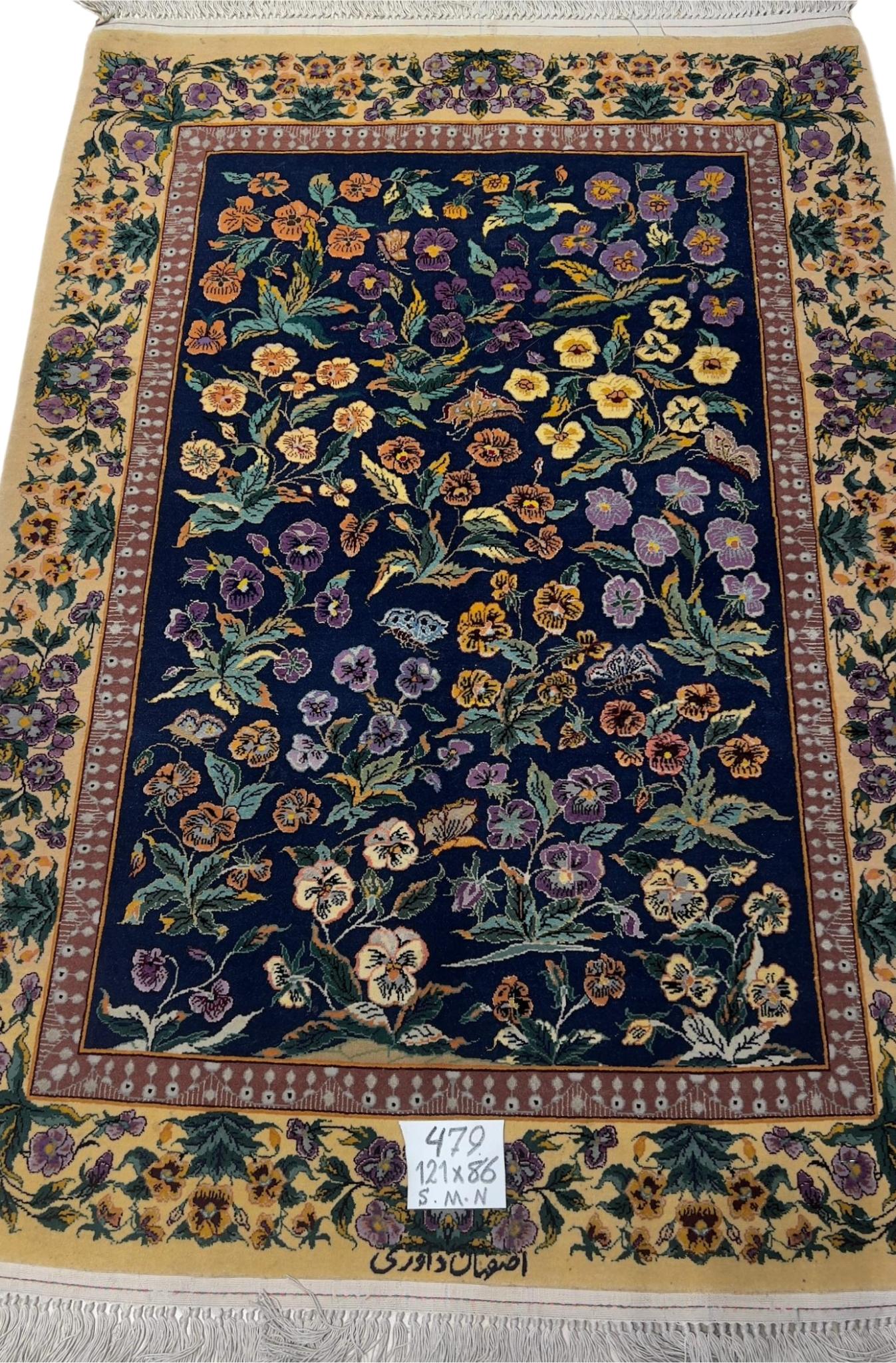 Persian Isfahan floral rug with vibrant pansy and butterfly design.
