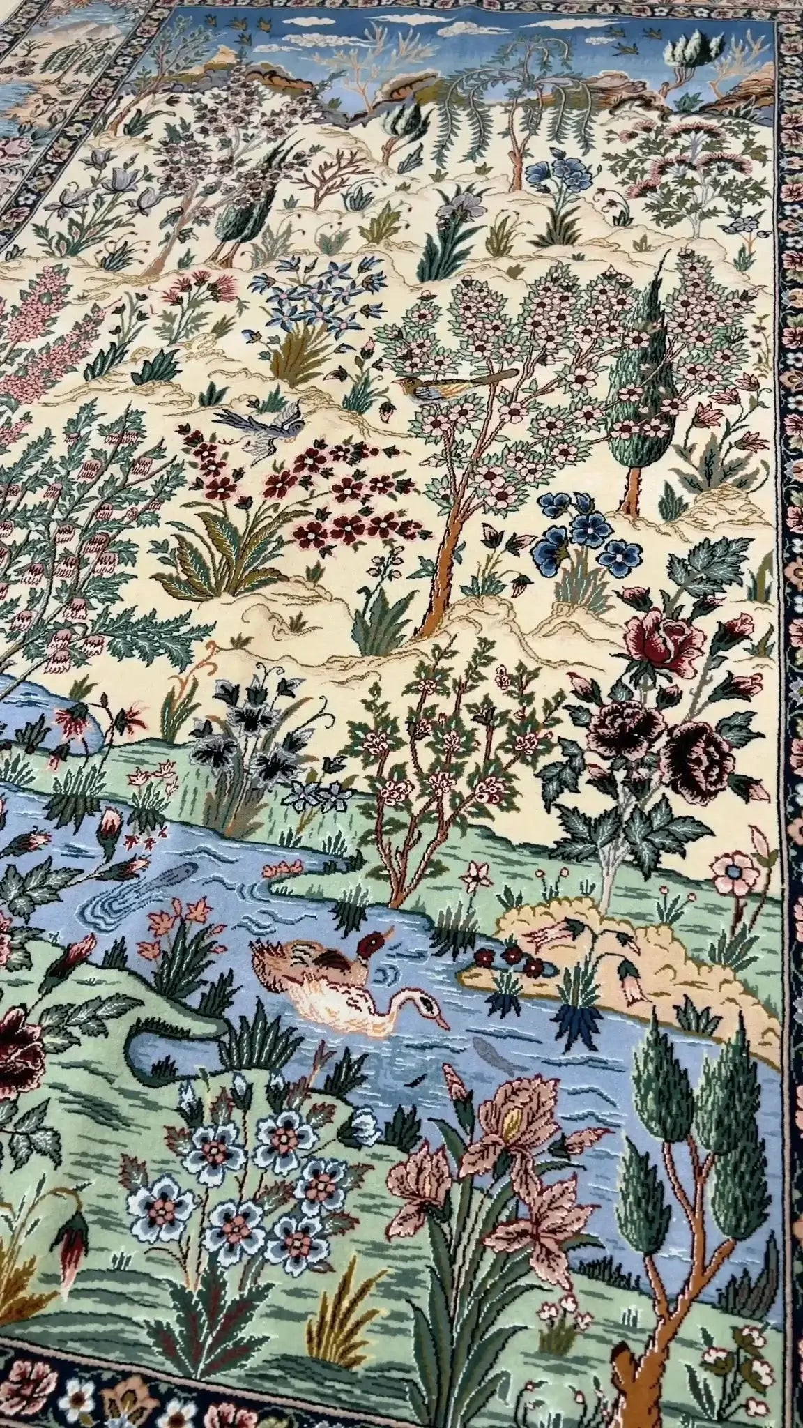 "Persian landscape scene rug with silk highlights, handwoven in Isfahan, Iran."
