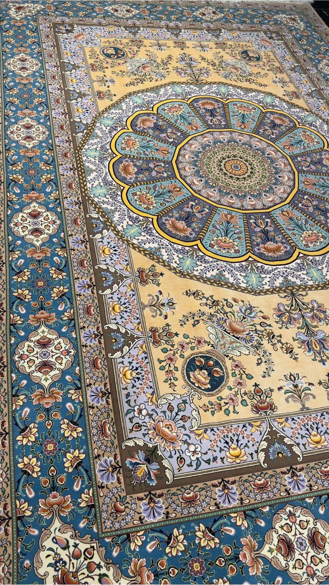 "Master Moeidie’s Isfahan rug showcasing detailed knot work and vibrant colors."