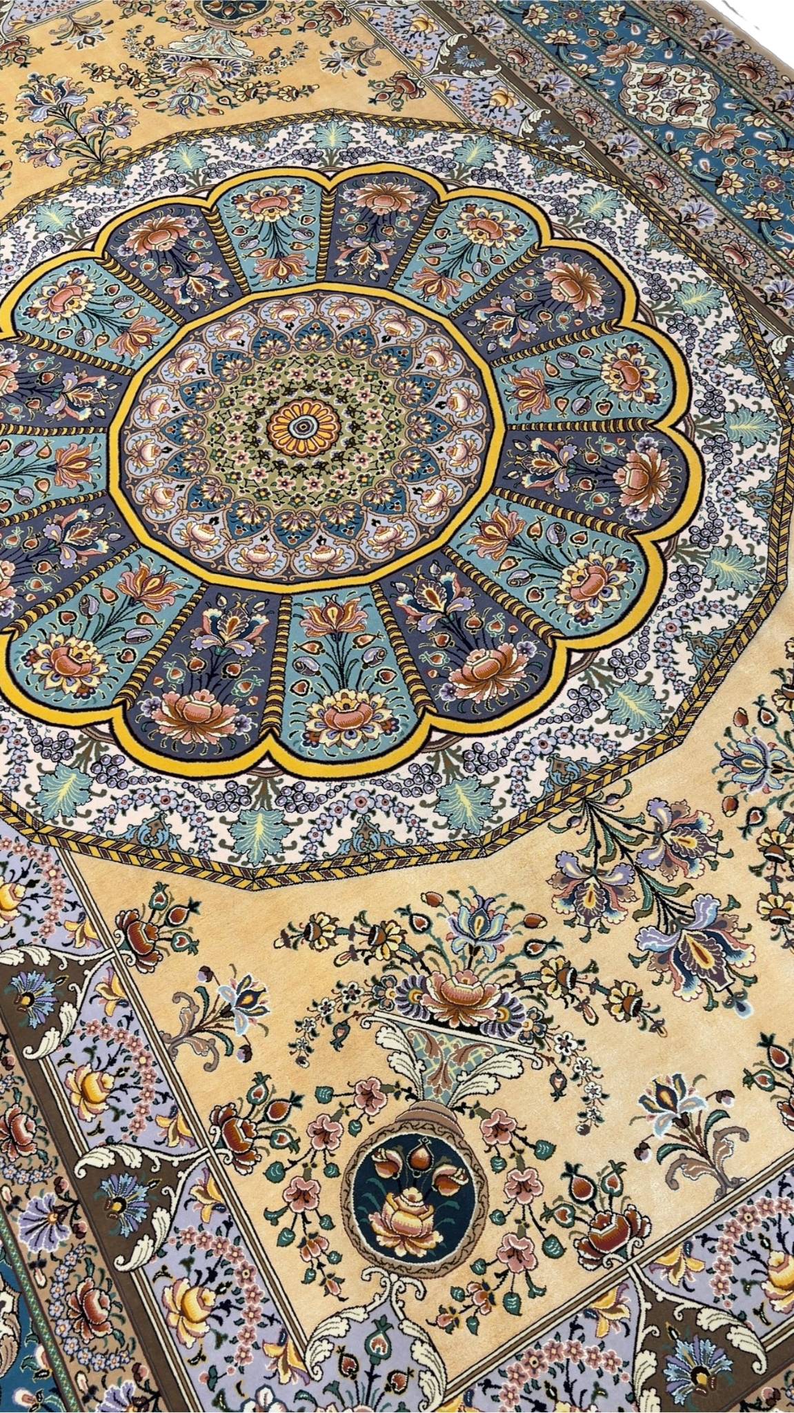 "Close-up of intricate silk field on Isfahan rug with traditional Persian designs."