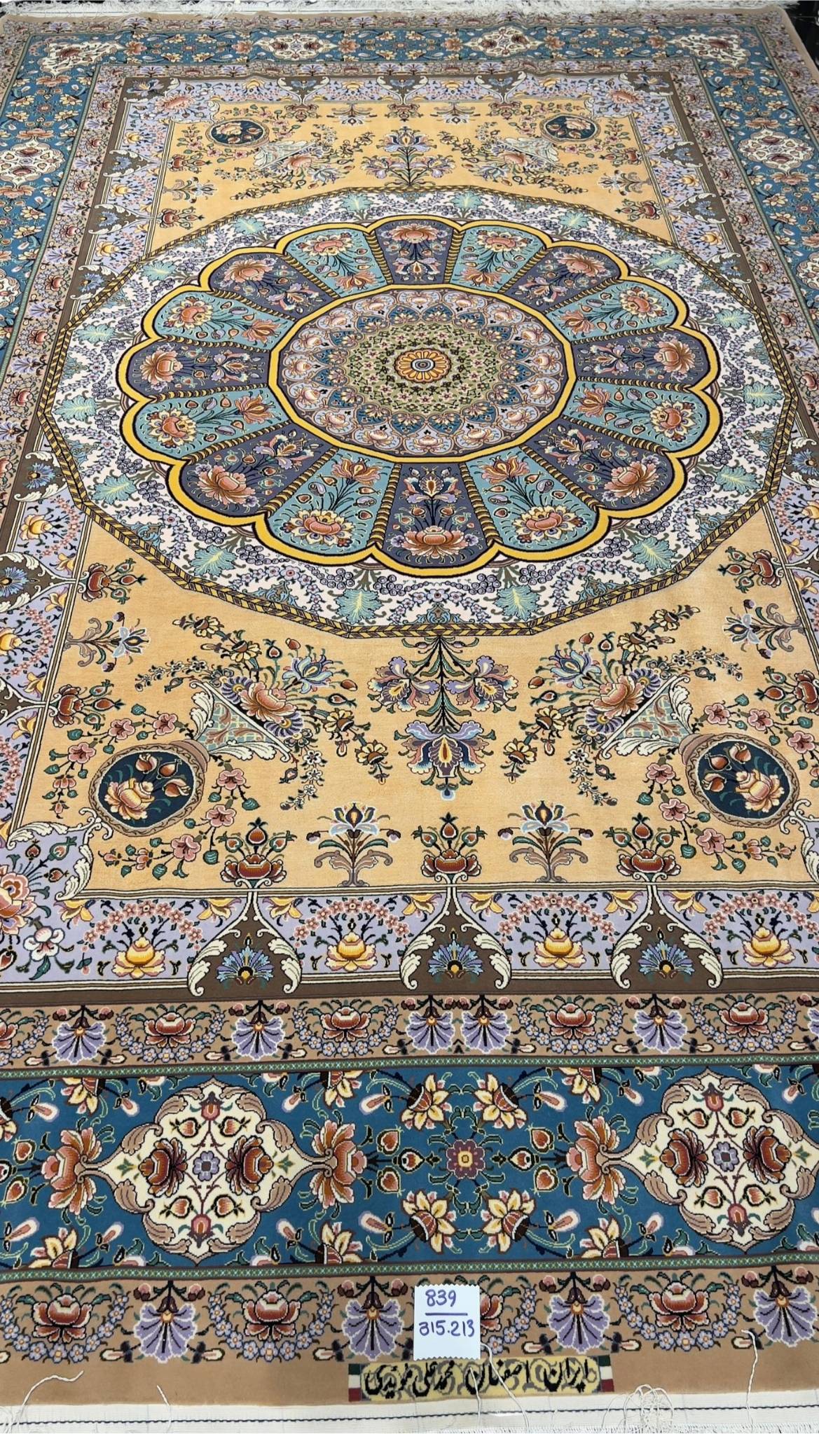 "Hand-knotted Isfahan rug by Master Moeidie, featuring silk floral patterns, 7.9 x 5.1 feet."