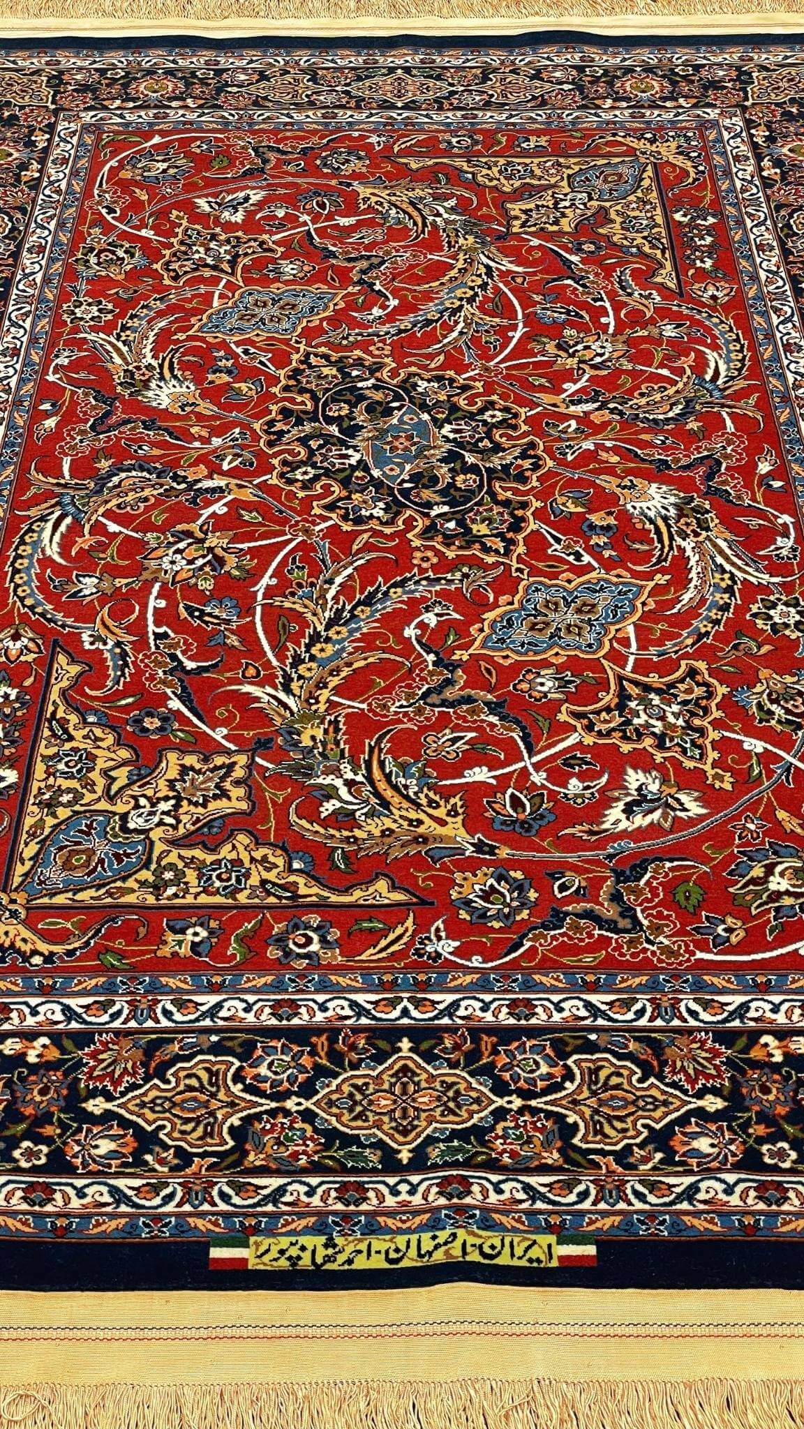 Intricate floral design on luxury red and blue Persian rug