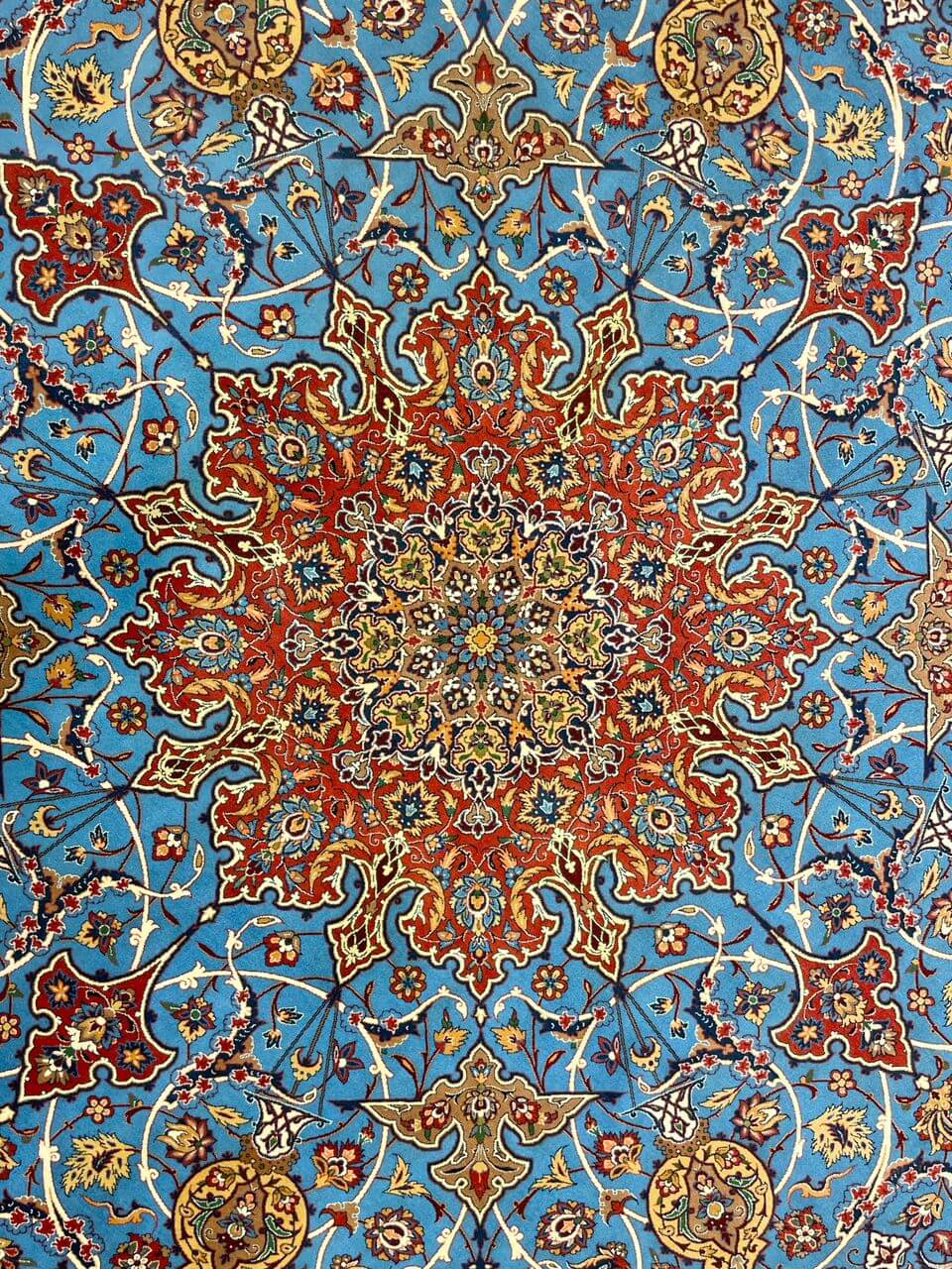 "Close-up of intricate knotwork on authentic Persian rug with natural dye, Isfahan origin."
