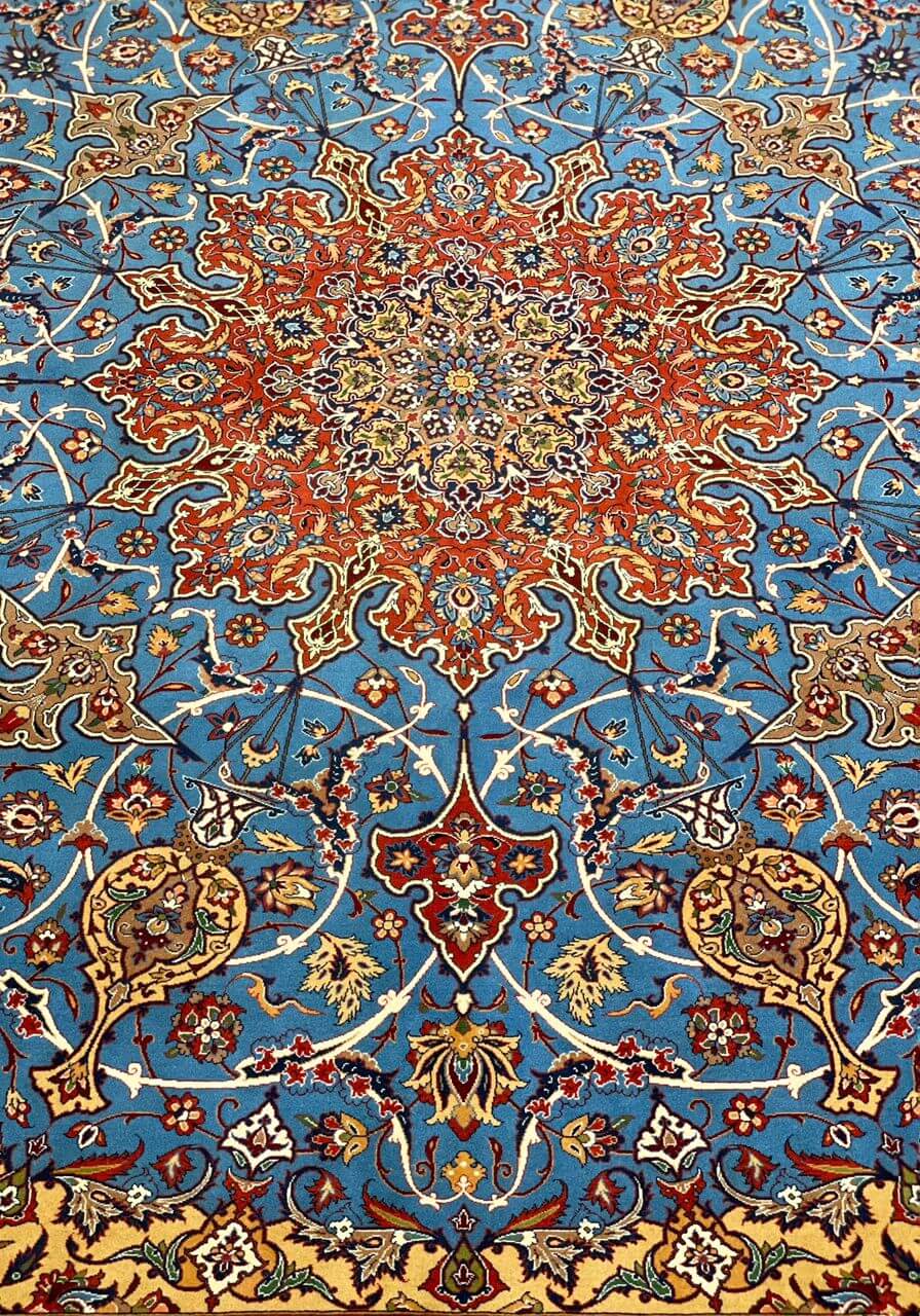 "Close-up of natural dyed wool and silk blend in red and blue Persian rug."
