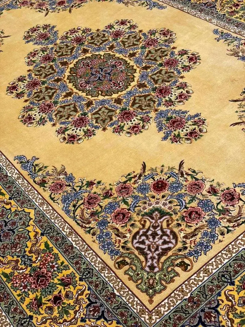 Artisanal silk carpet adorned with traditional floral motifs