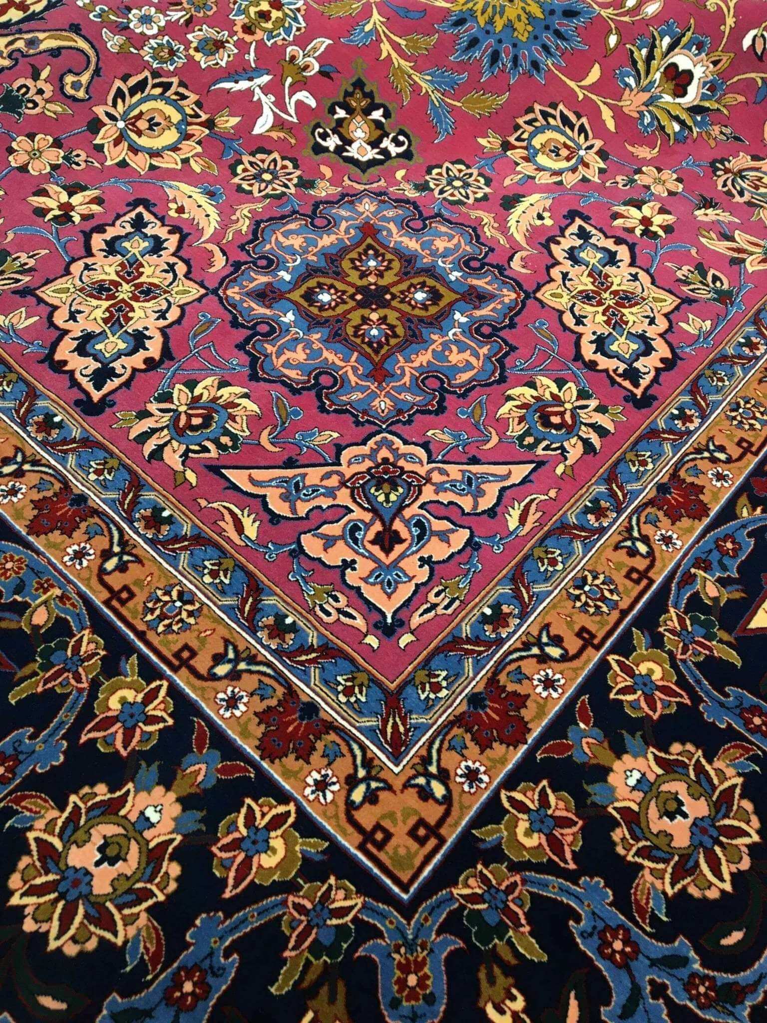 Side angle of the purple and grey oriental rug, highlighting the intricate knot work and delicate floral details.
