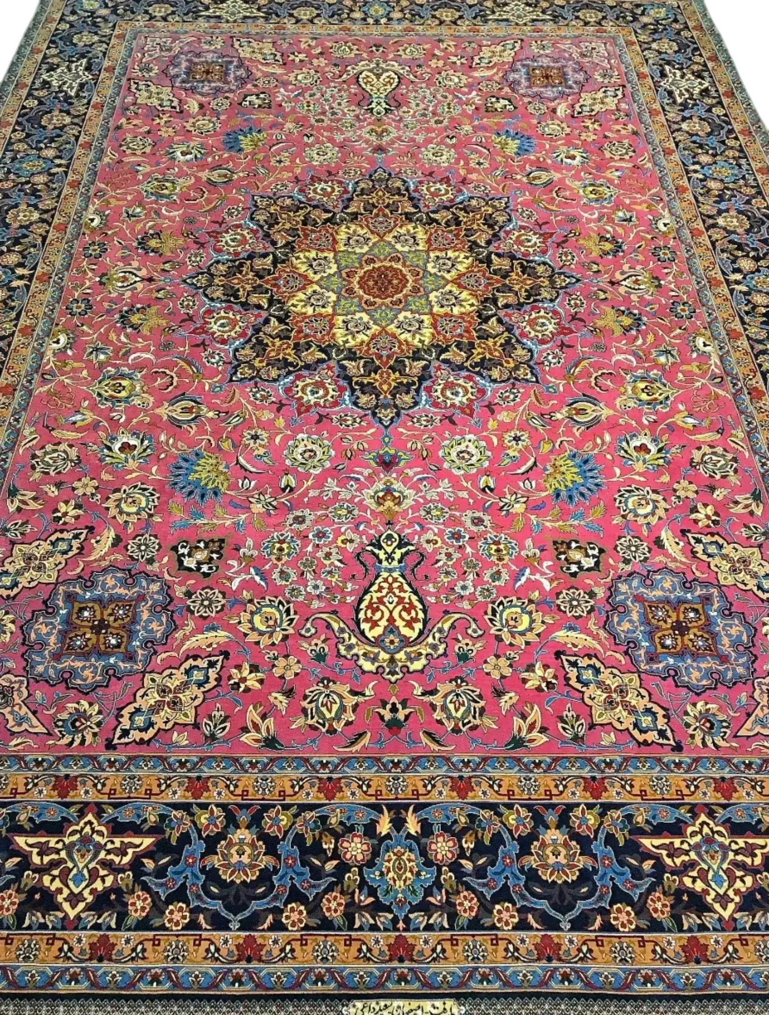 Hand-knotted purple oriental rug with intricate floral patterns, highlighting a vibrant medallion in the center, surrounded by a decorative border.
