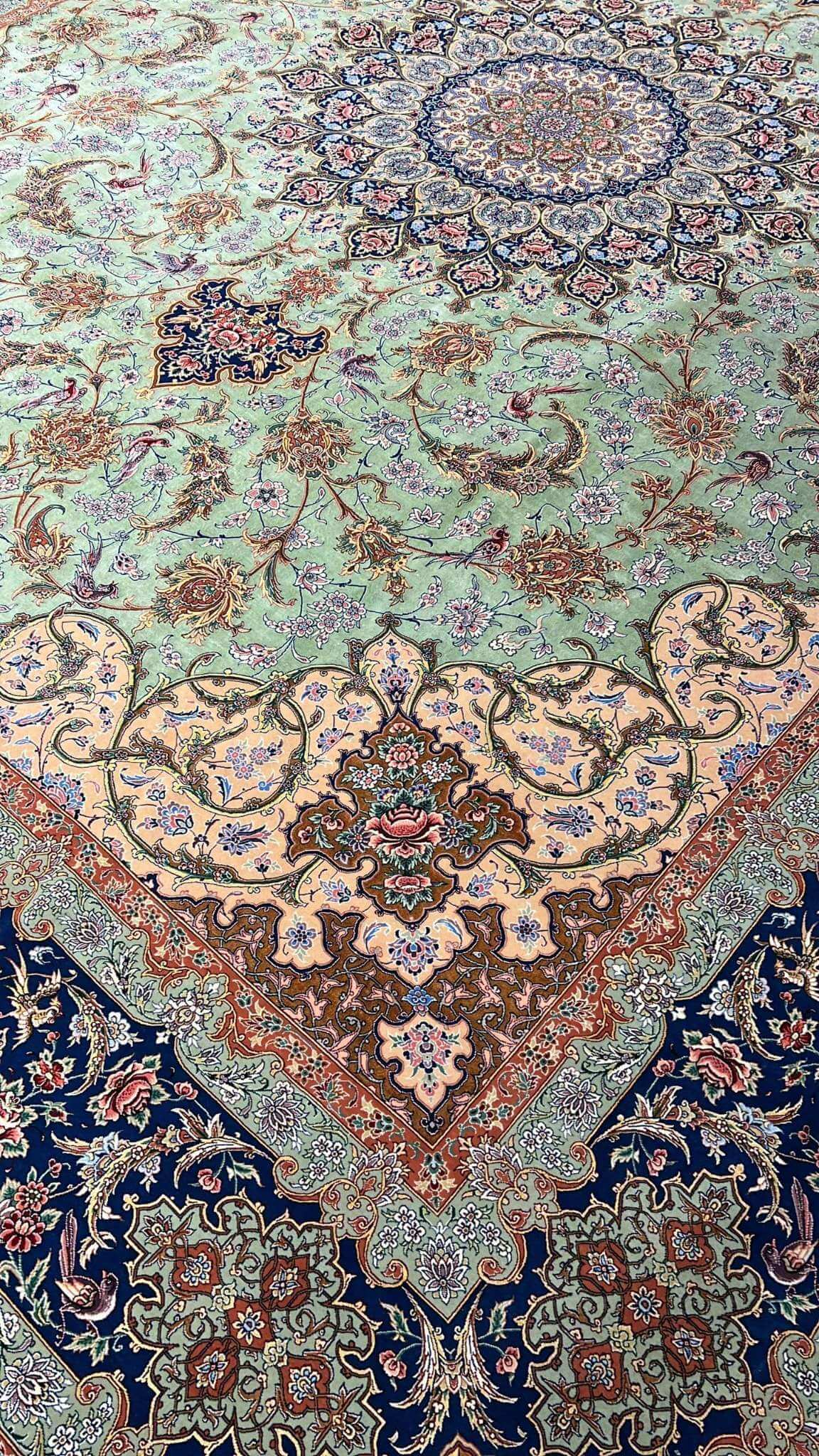 "Side view of hand-knotted Persian rug, made with silk warp and wool-silk blend."
