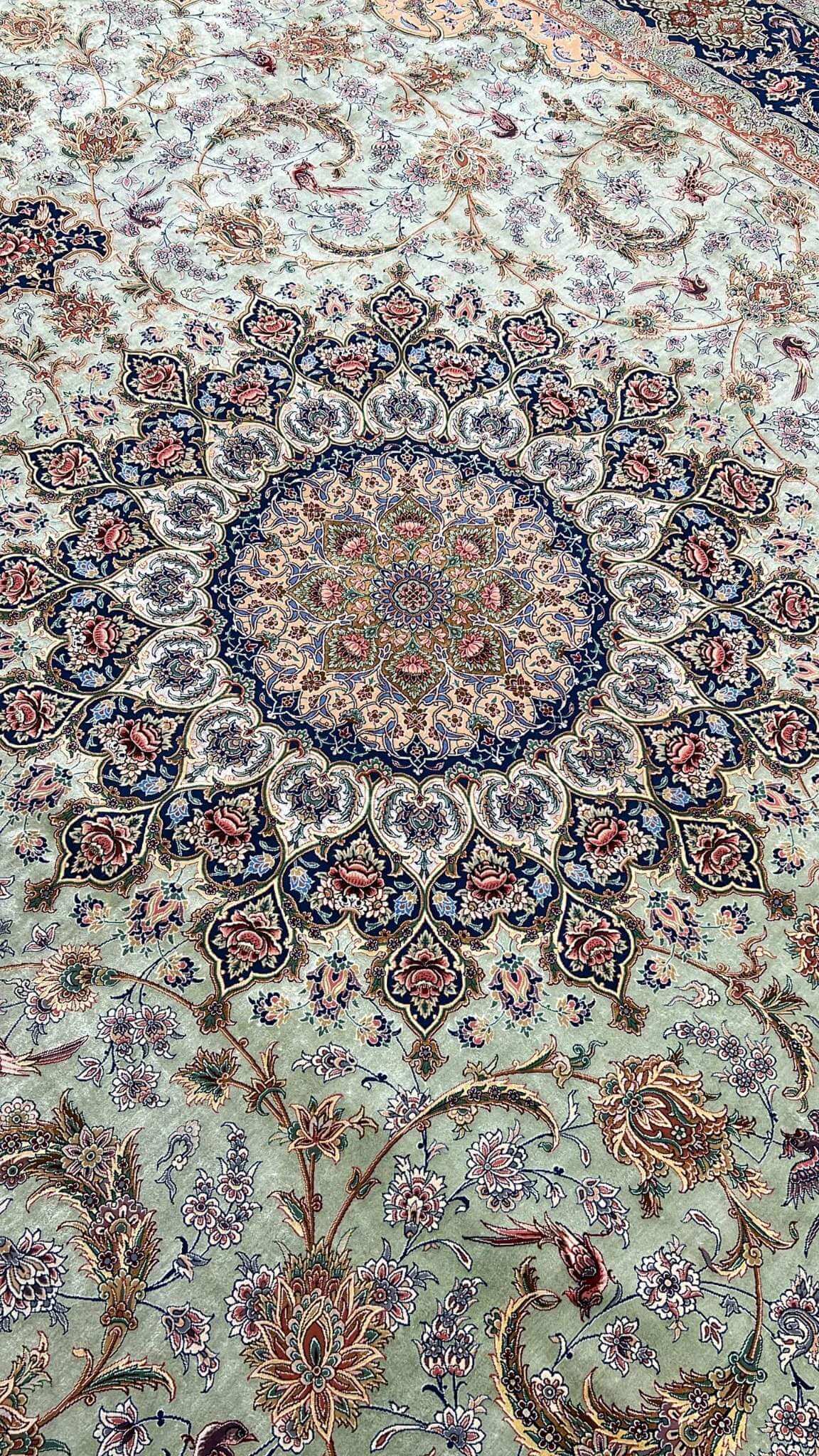 "Close-up of intricate knotwork on Persian silk rug, featuring a light green silk field."