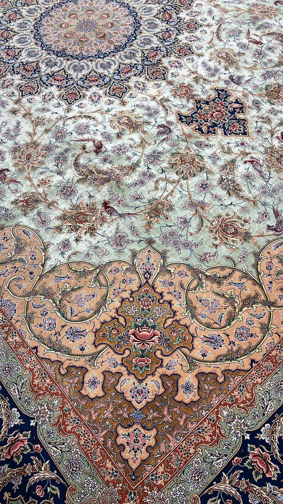"Detailed corner view of the Persian rug, 400x300 cm, displaying floral and medallion motifs."