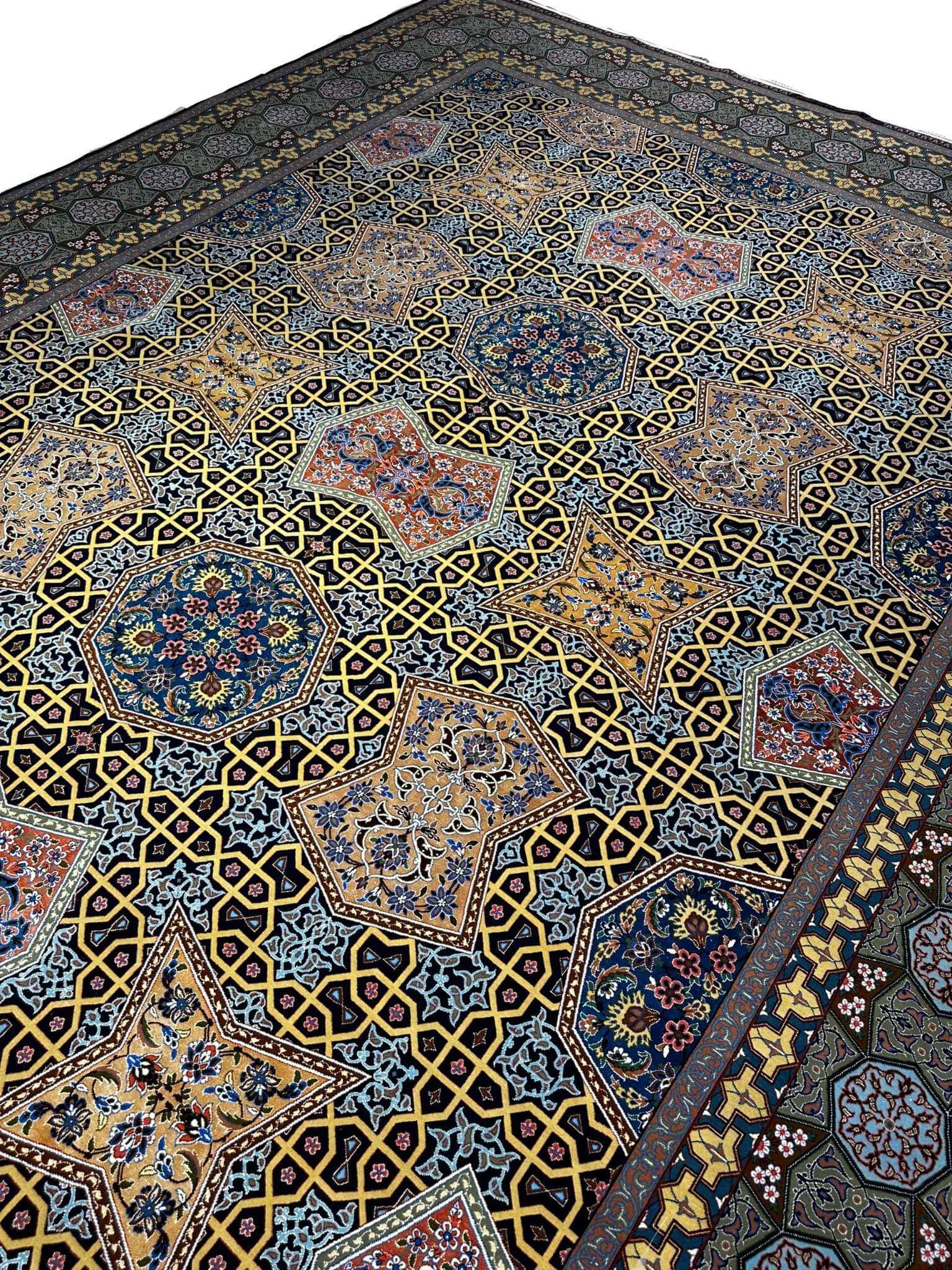 Large Persian area rug from Isfahan, Iran, made with wool and silk by Master Haghighie. Hand-knotted with intricate patterns, this 382x273 cm (12.5x9 feet) rug is a masterpiece of Persian craftsmanship.