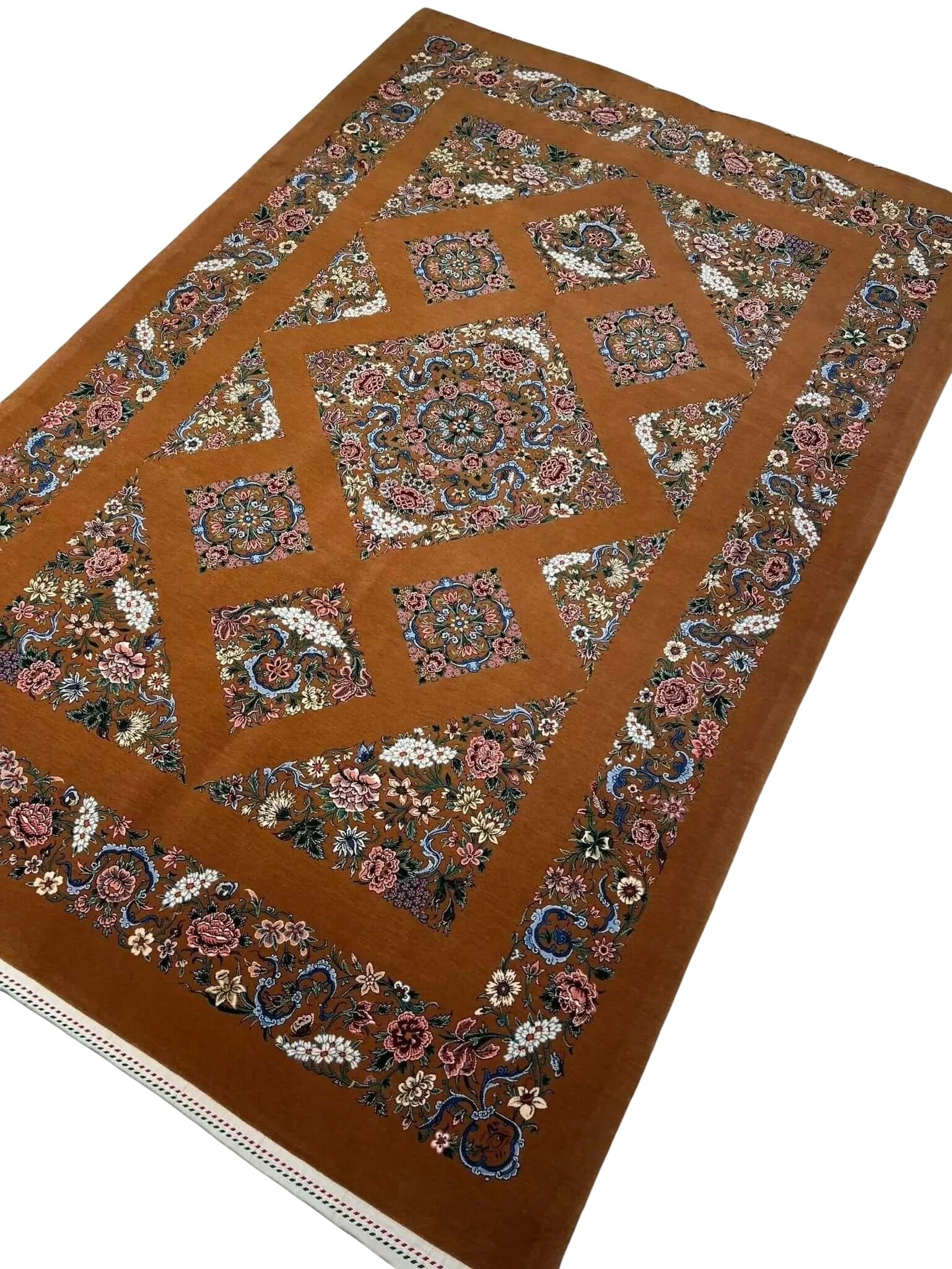 Luxury wool and silk Kazak-style carpet with vibrant natural dyes and traditional patterns.
