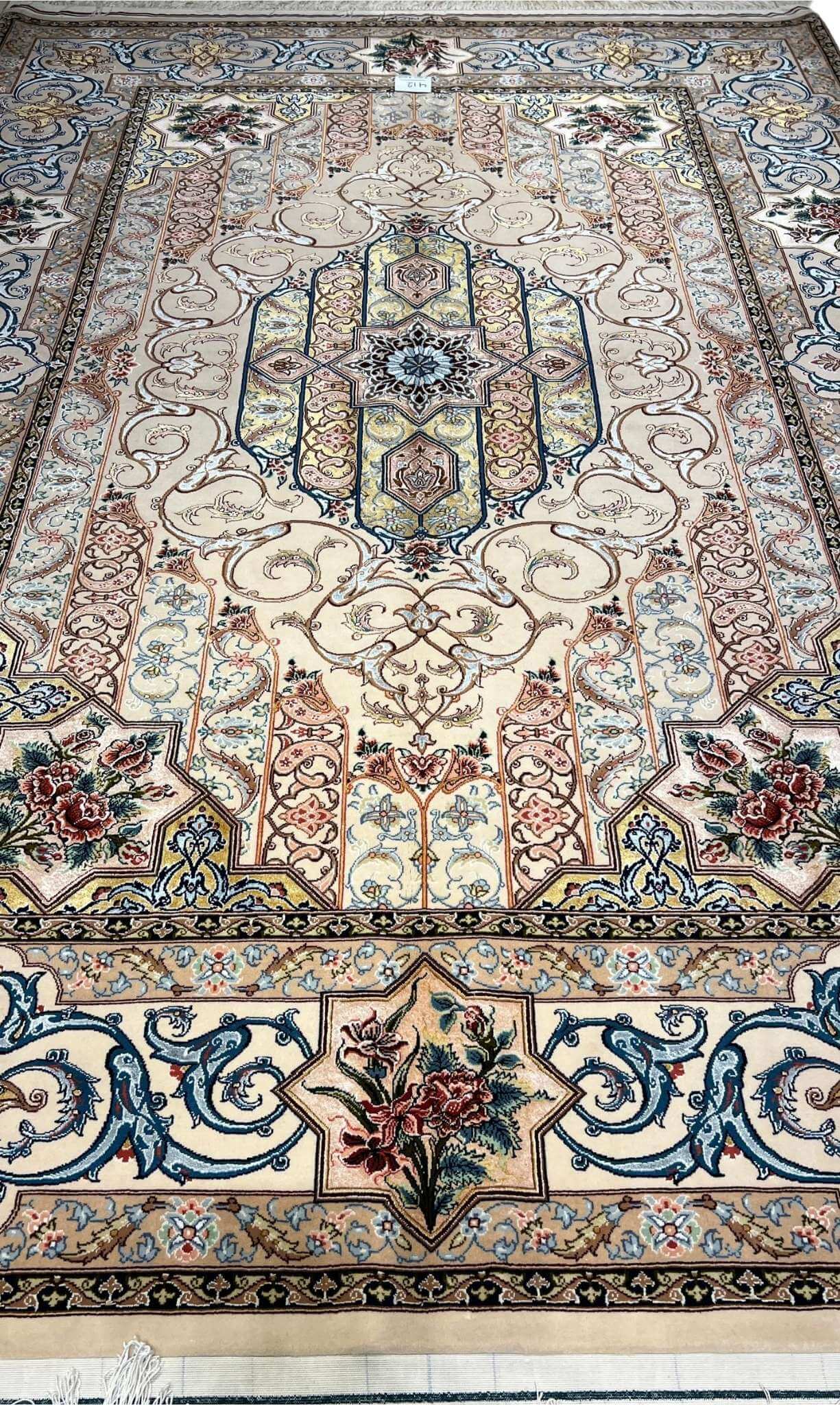 "Hand-knotted Isfahan Persian rug with an intricate floral medallion design and silk-wool blend pile."