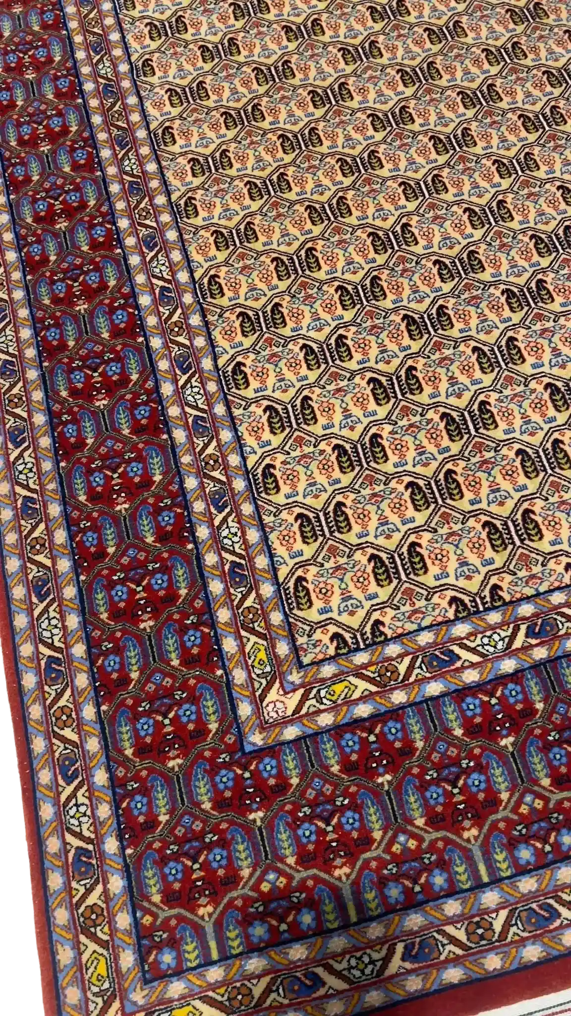 "Antique Persian rug with vegetable dyes and intricate patterns"
