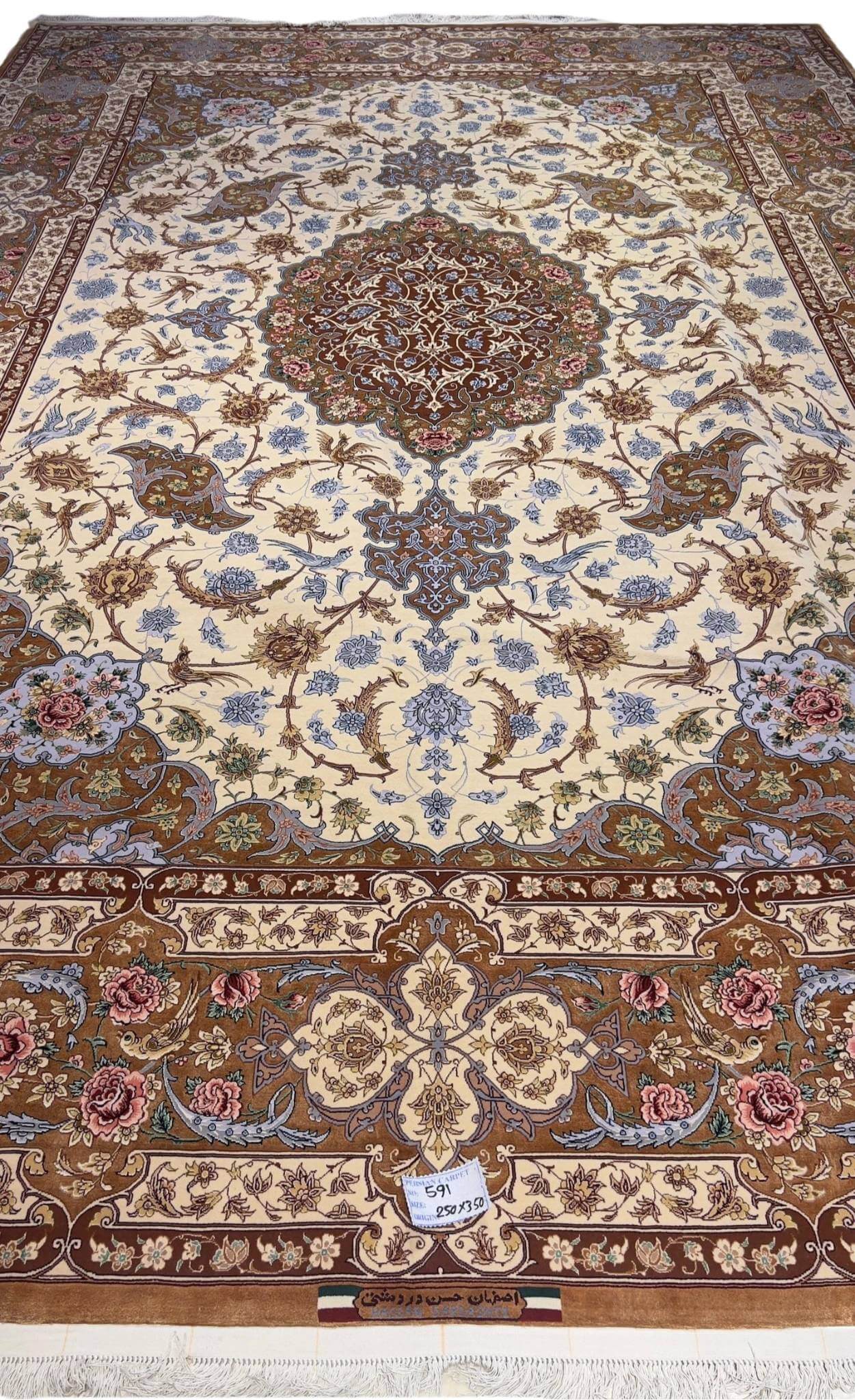 "Hand-knotted Isfahan rug featuring a silk medallion and borders with a wool floor, crafted by Late Master Hassan Dardashtie."
