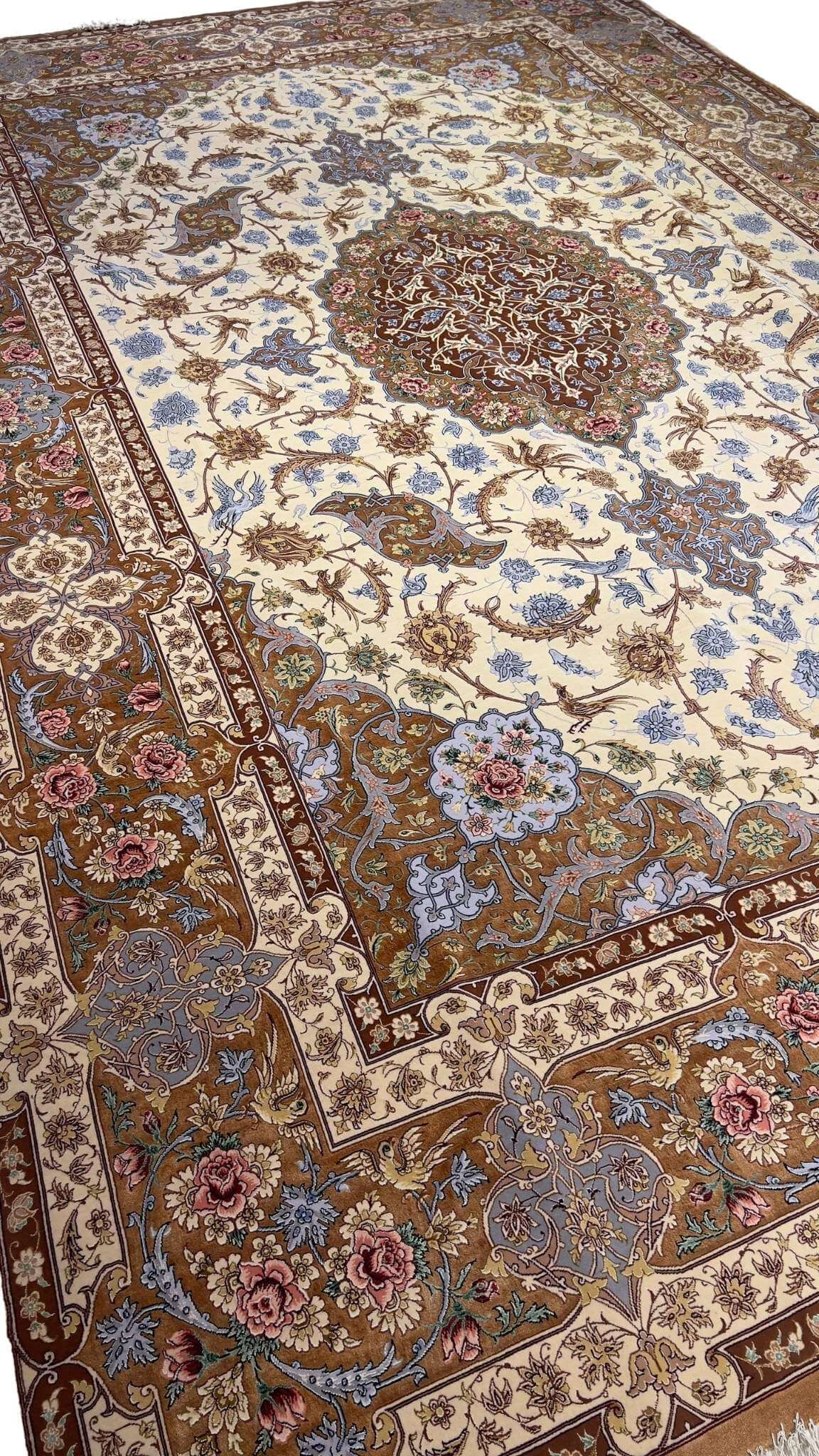 "Master Hassan Dardashtie’s handwoven rug with silk accents and natural dye colors."
