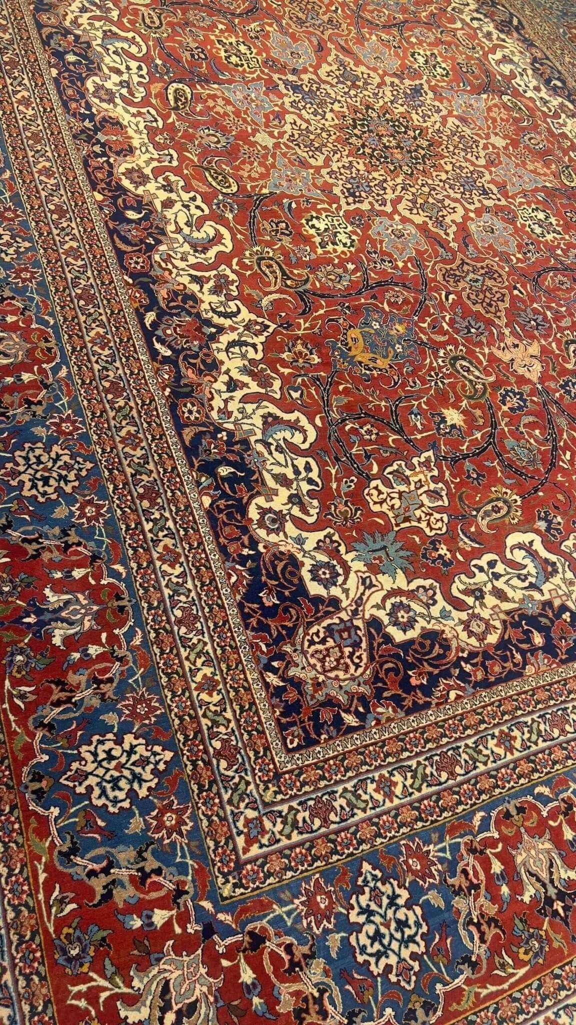 "Detailed antique Persian rug with medallion and curvilinear islimi motifs"

