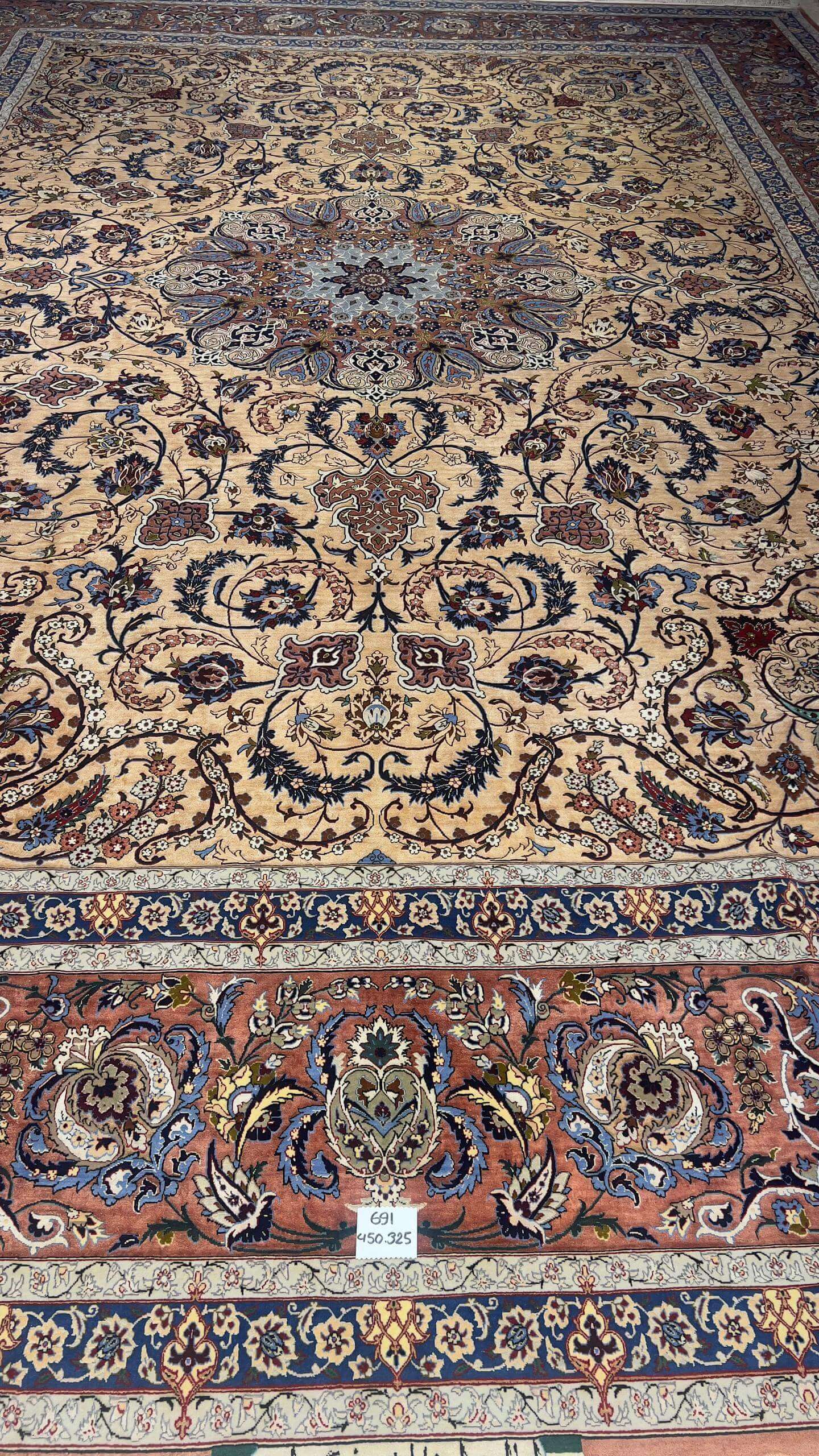 Full display of the Handcrafted Silk Rufugaran Rug with its symmetrical medallion design