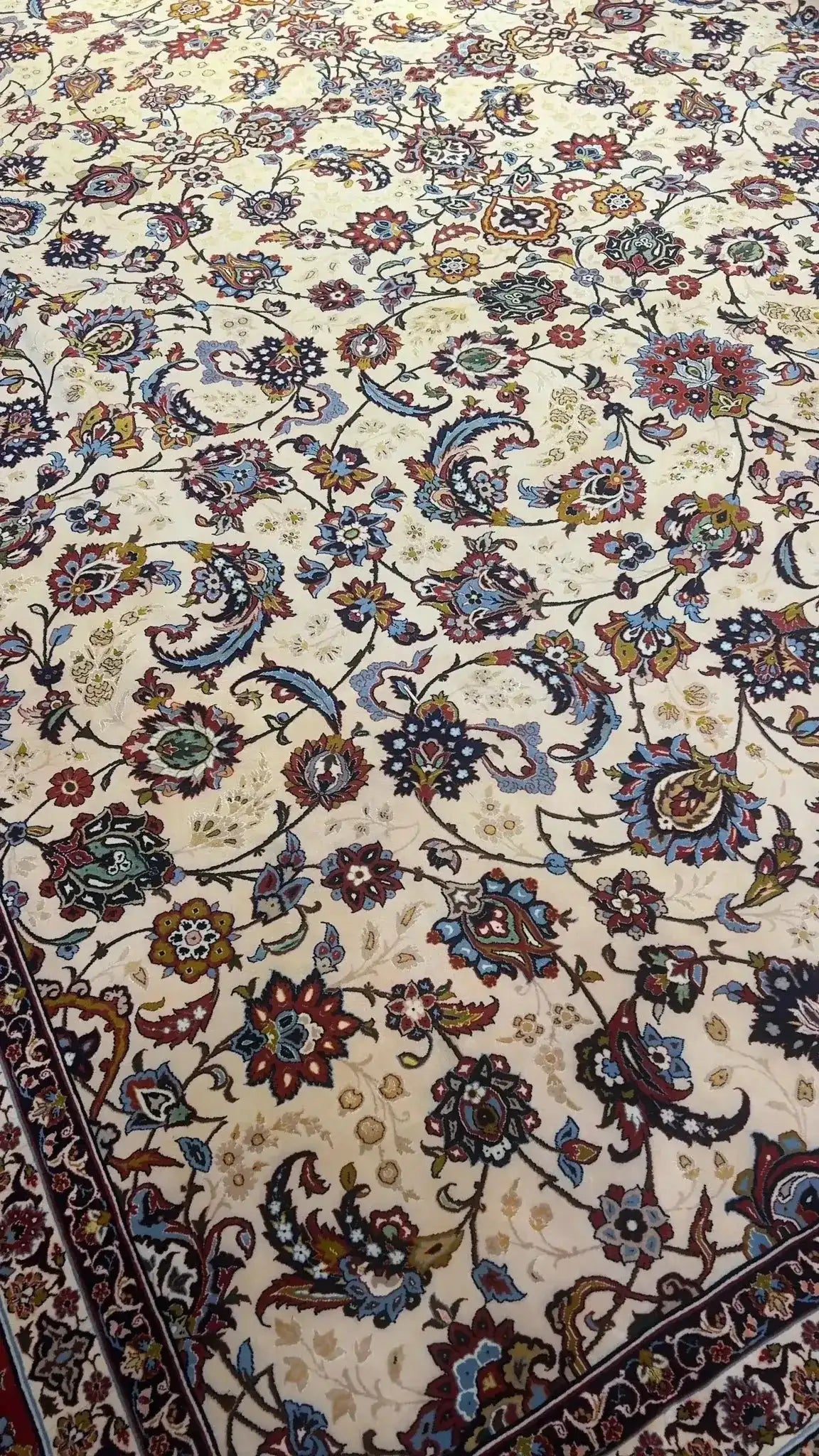 Oriental rug showcasing an elaborate floral pattern throughout its design