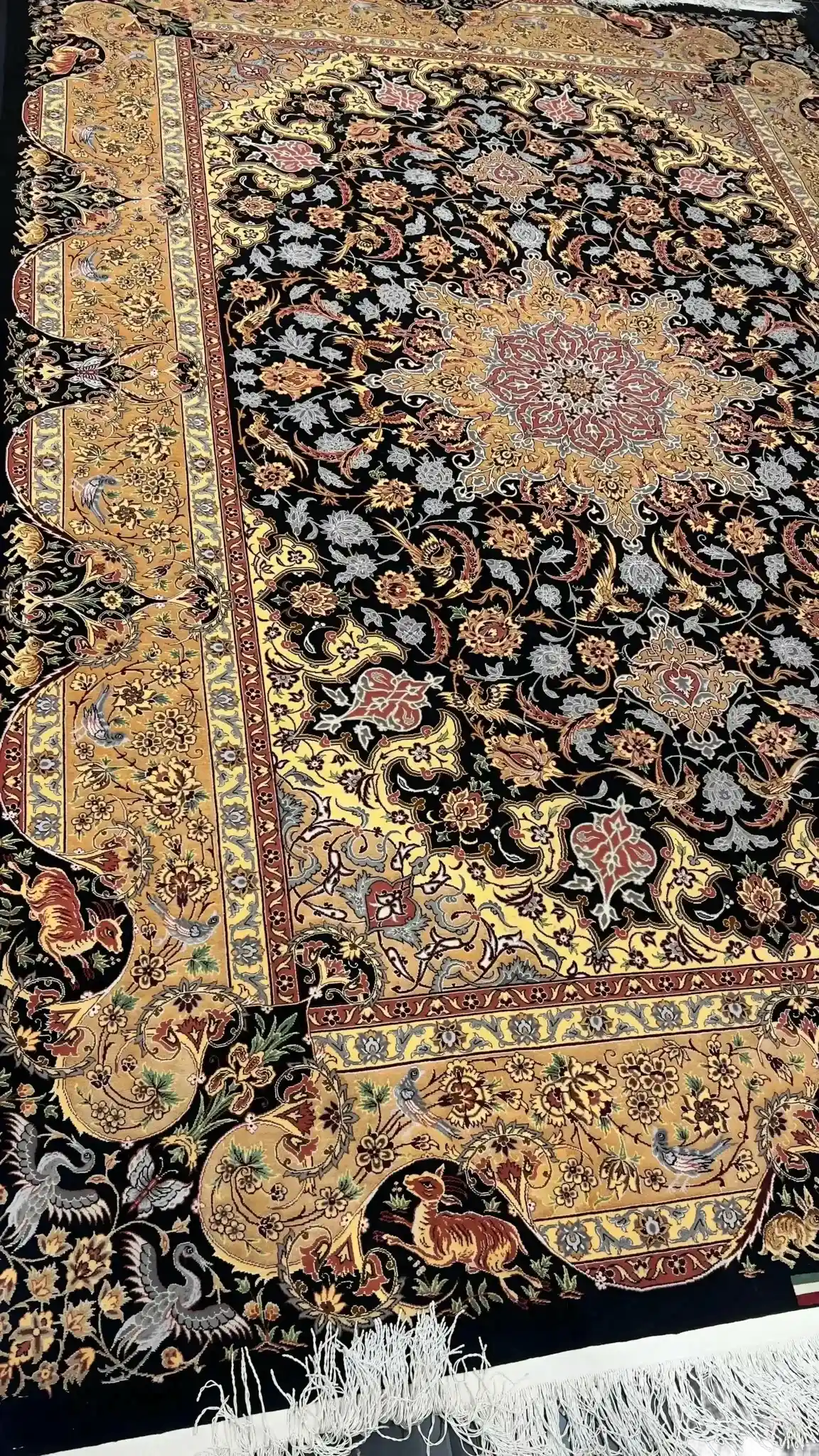 Elegant black and golden rug by Dardashtie featuring traditional artistry