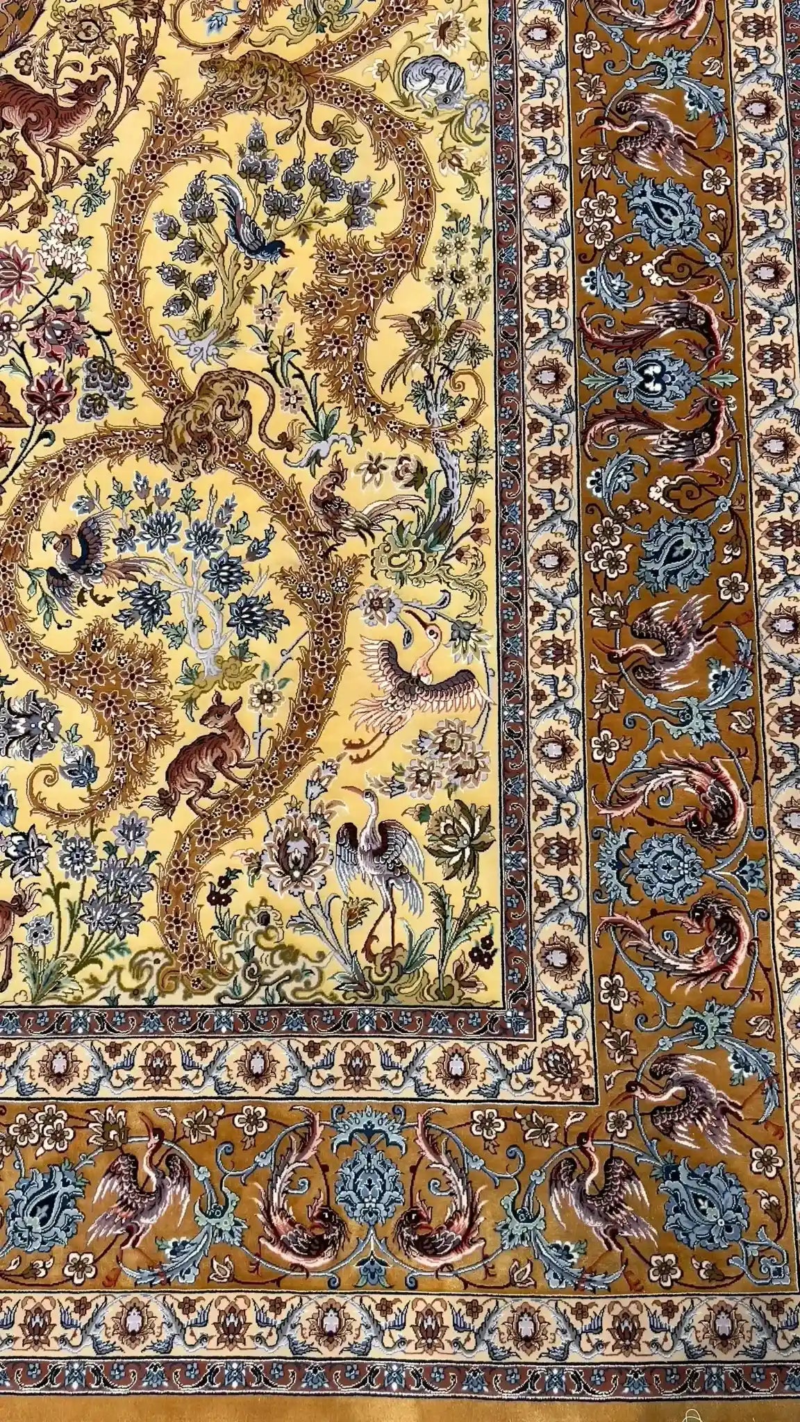 Elegant Dardashtie rug showcasing sophisticated floral patterns on a golden silk background