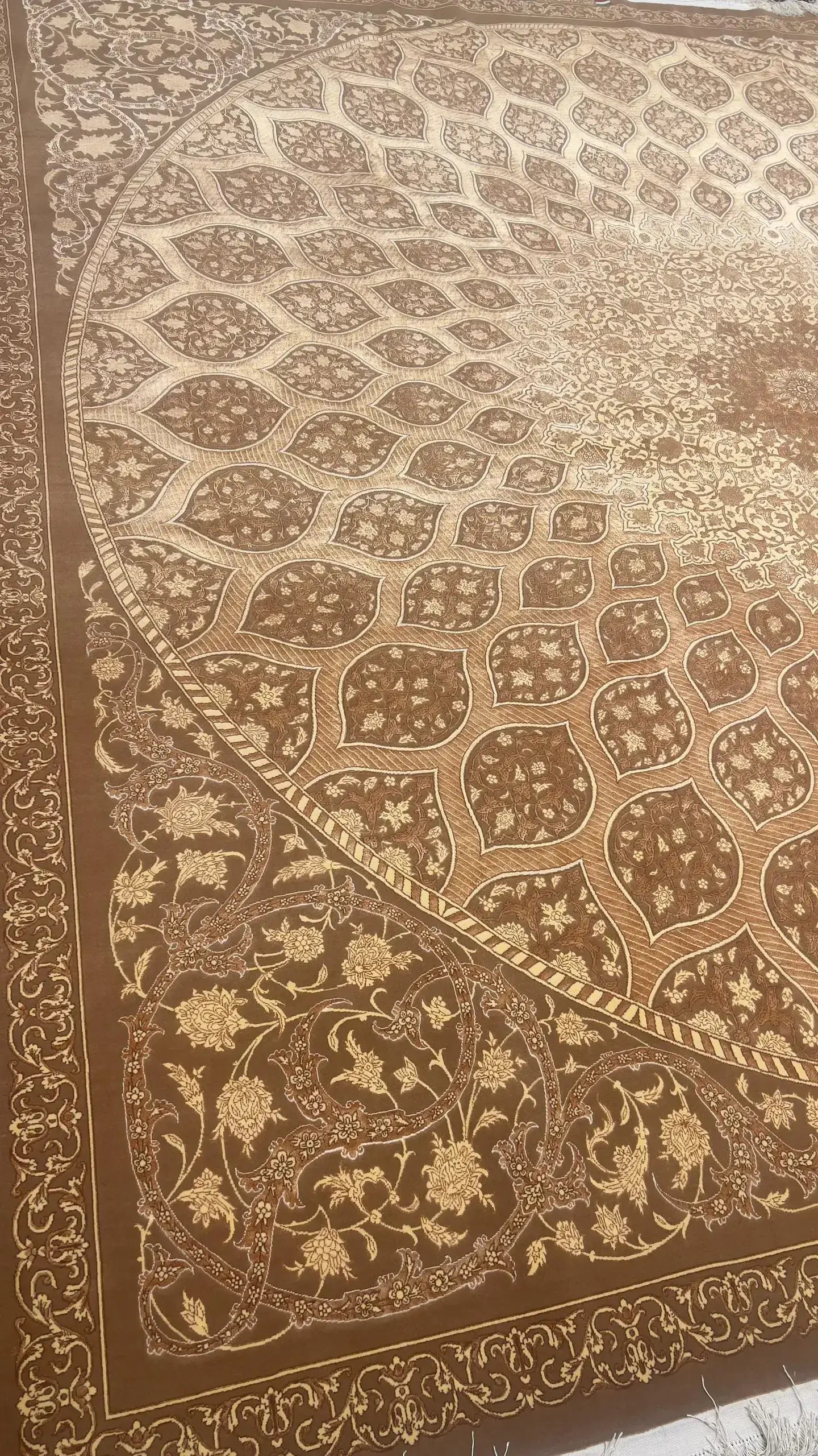 "Master Hassan Dardashtie’s handwoven rug with dome patterns and premium silk materials."
