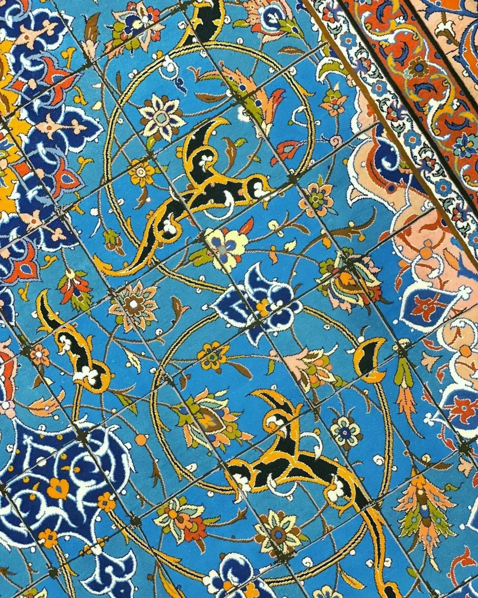 "Handmade Persian rug with intricate detailing in shades of blue, gold, and orange, crafted by Master Haghighie, 325 x 200 cm."
