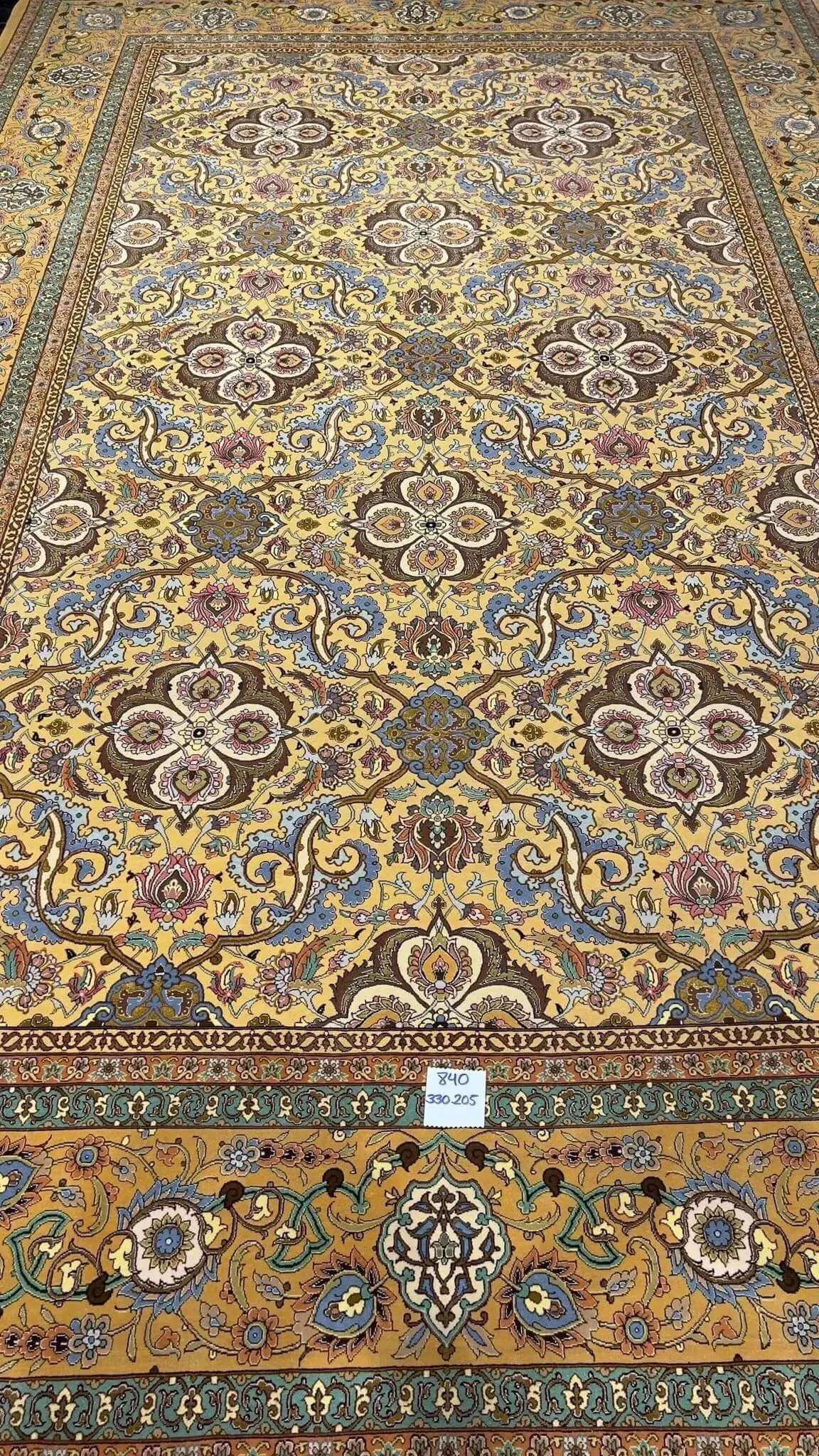Handcrafted wool and silk carpet by Master Weaver Haghieghie with intricate patterns