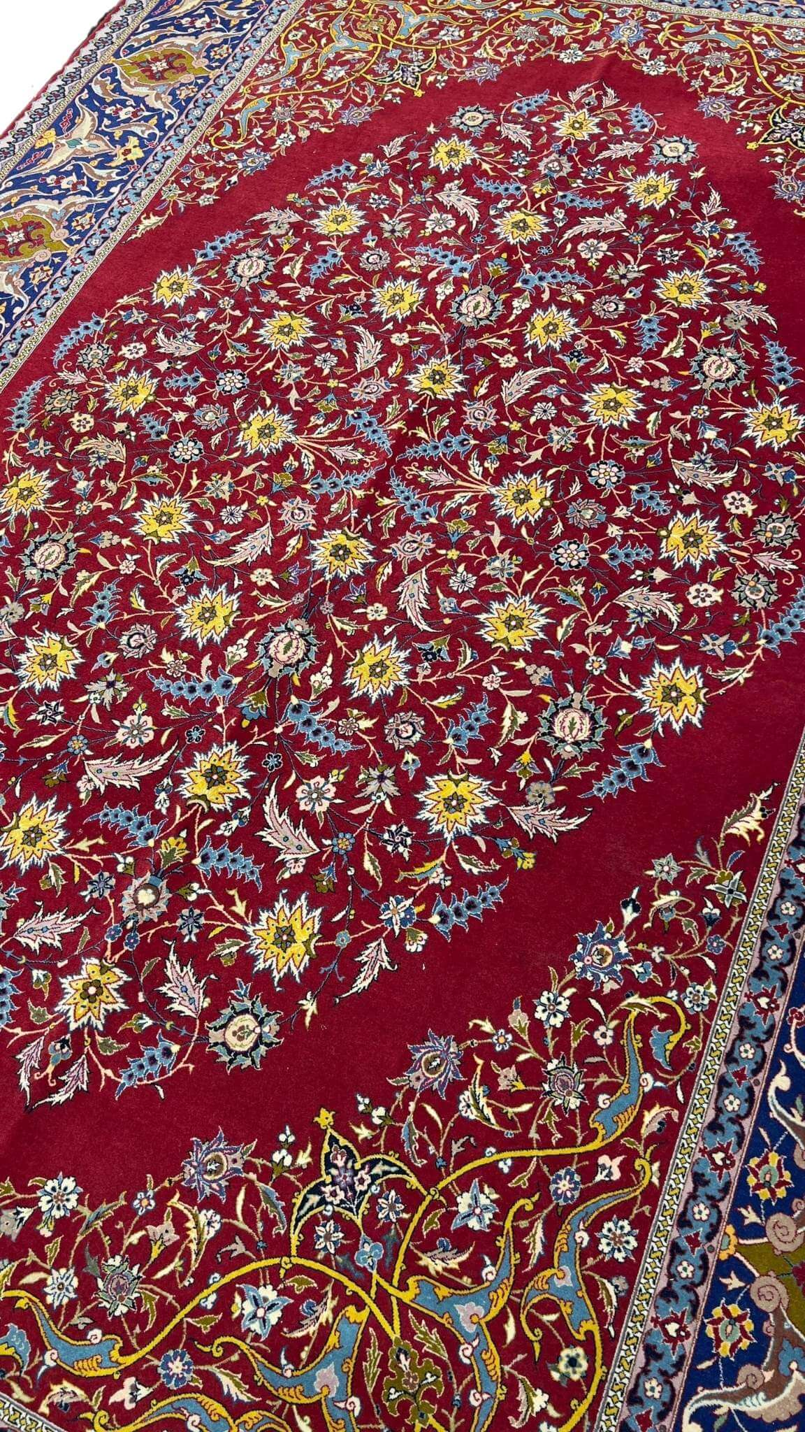"Hand-knotted finest red antique rug from Isfahan, crafted by Master Haghieghie"
