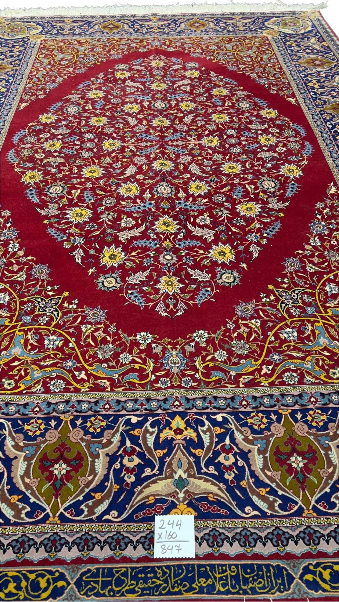 "70-year-old collectible red Persian rug with natural fibers and fine wool"
