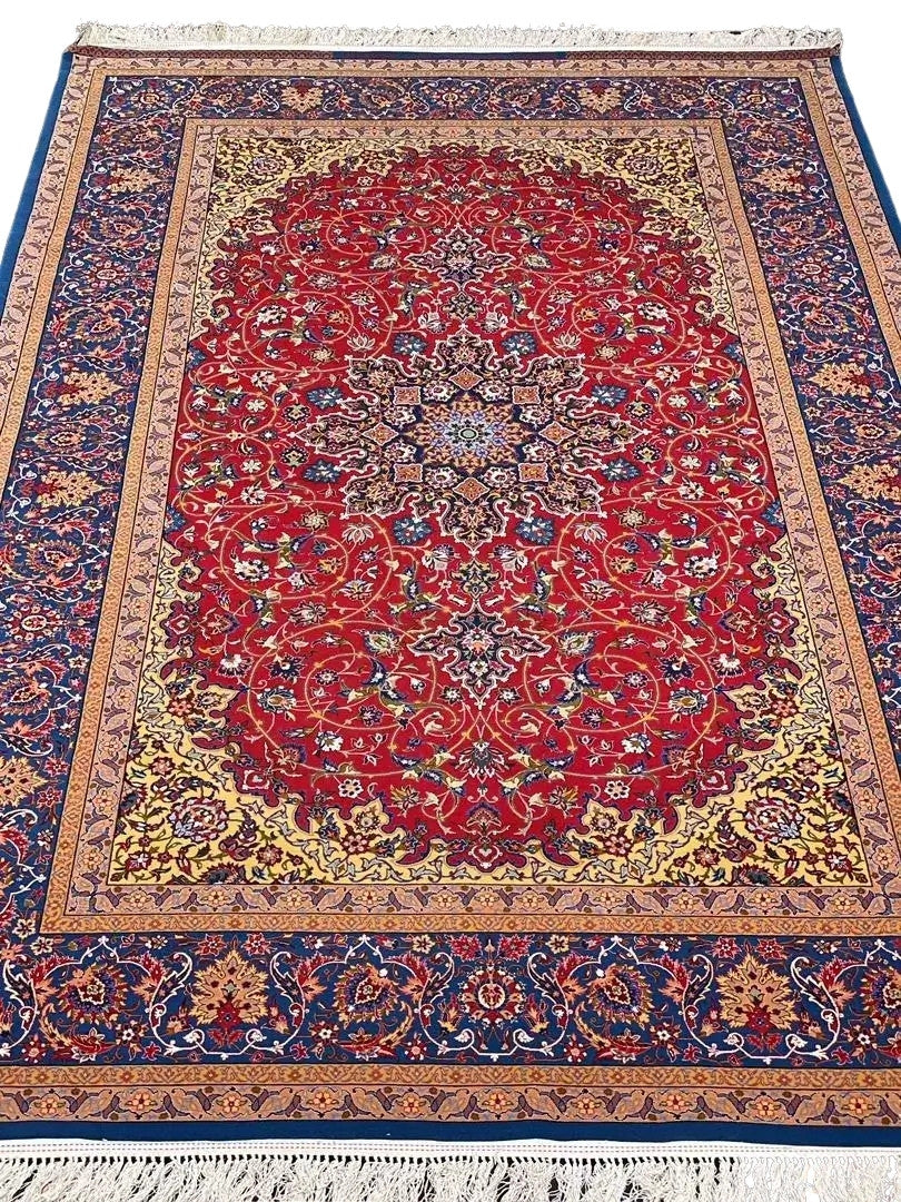 Luxurious red Persian rug with blue and gold accents, hand-knotted by Master Nasorollah Haghighie.
