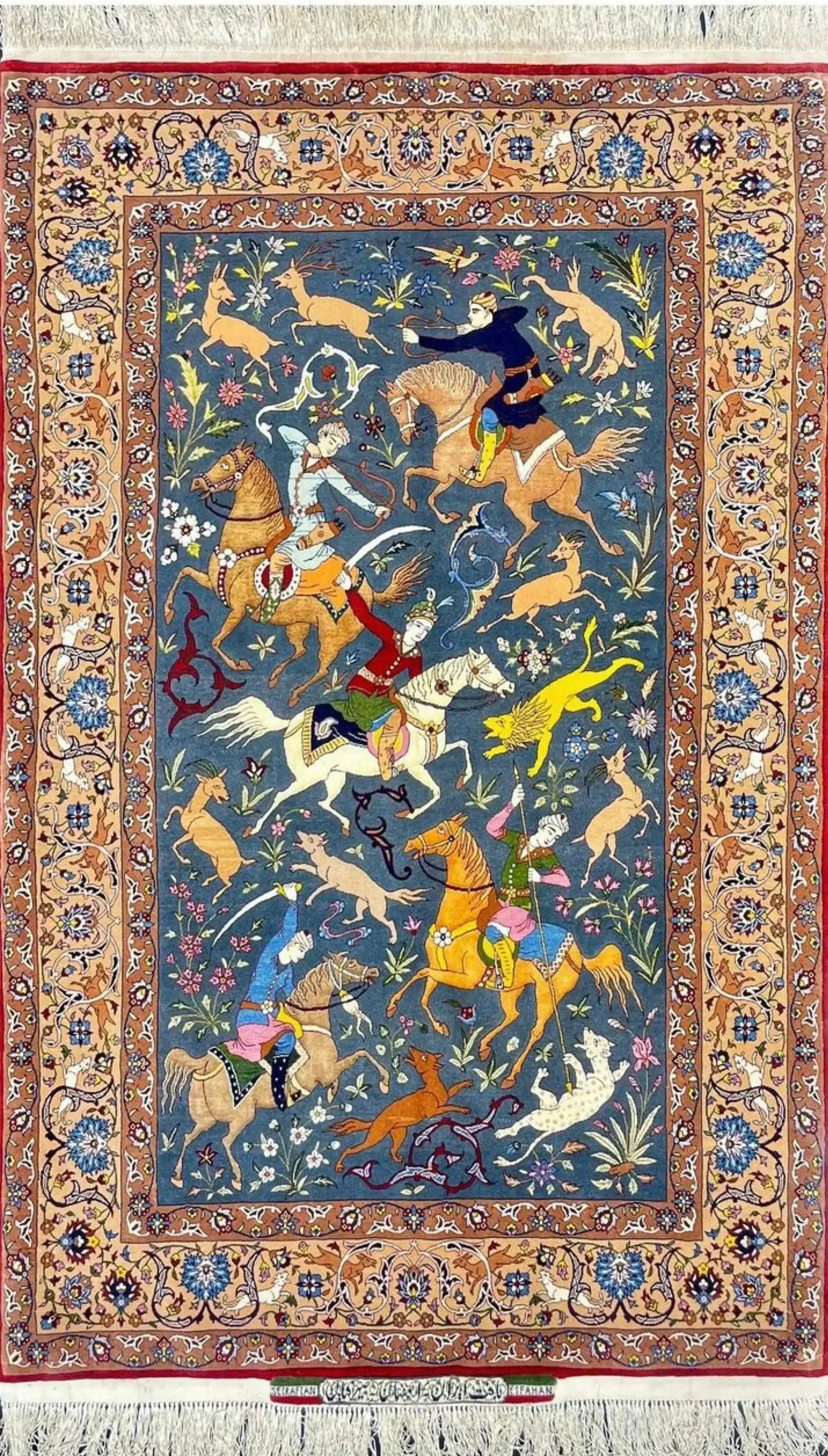 Hand-knotted Persian rug featuring an elaborate hunting scene by Master Hassan Seirafian.
