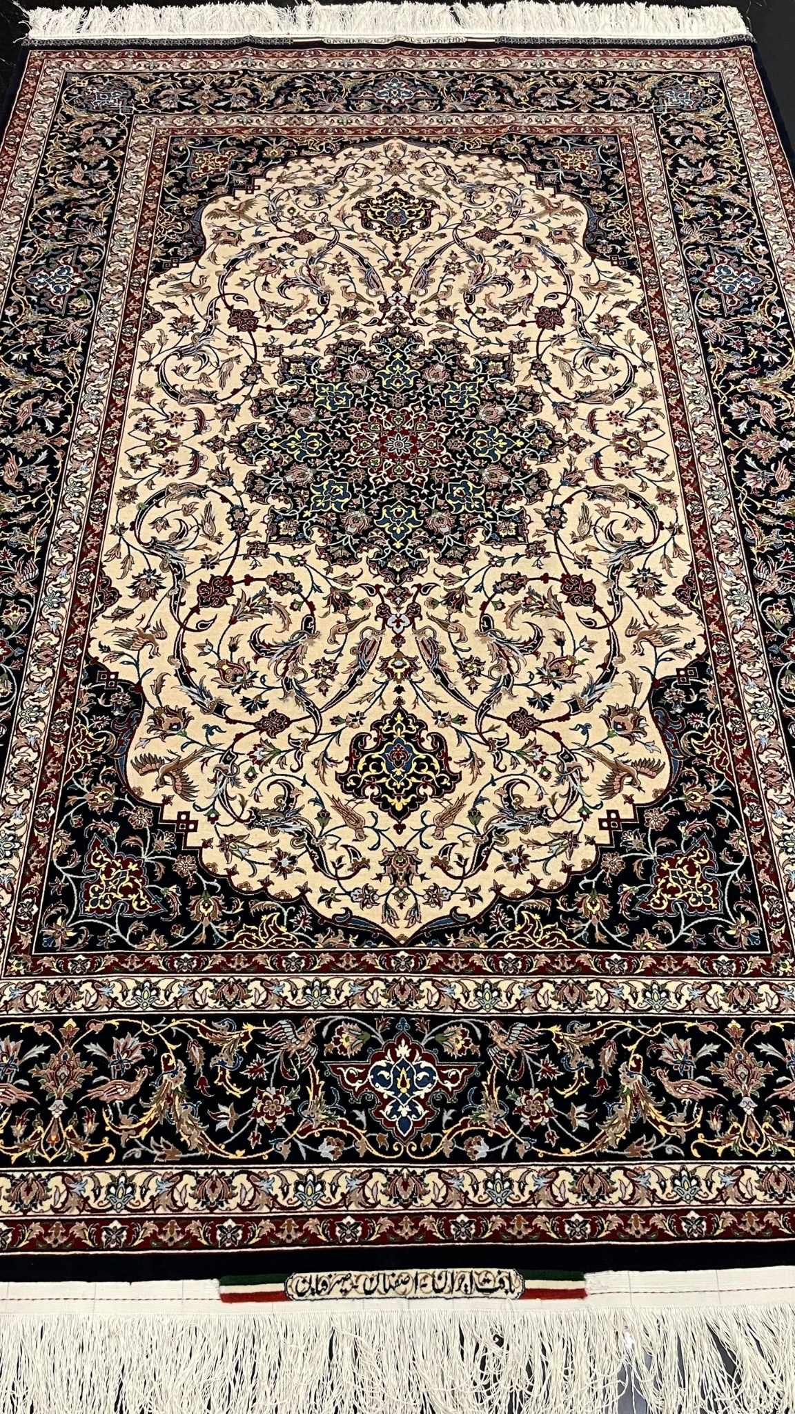 Luxury Persian carpet from Isfahan, showcasing intricate craftsmanship with natural dyed silk and wool.
