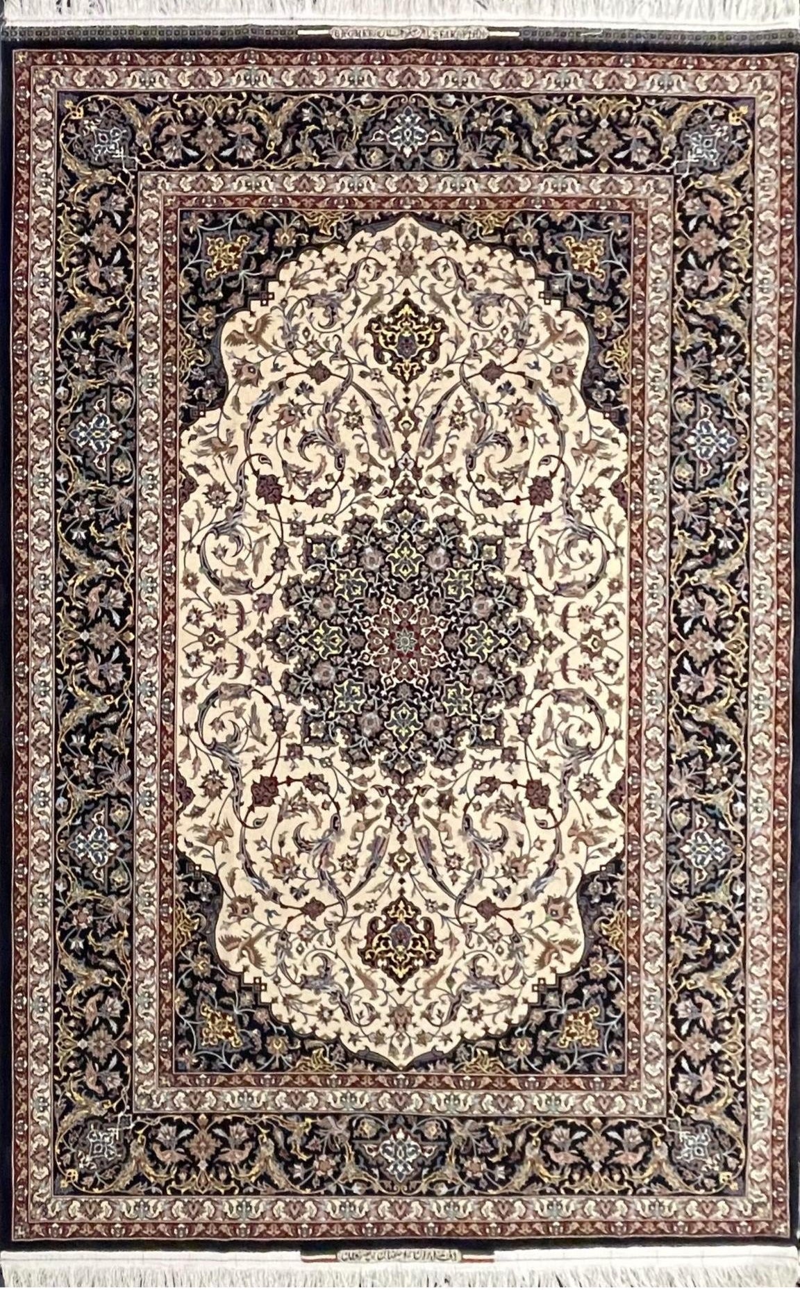 Hand-knotted Isfahan rug by Master Bagher Seirafian featuring a cream medallion design with floral and bird motifs.
