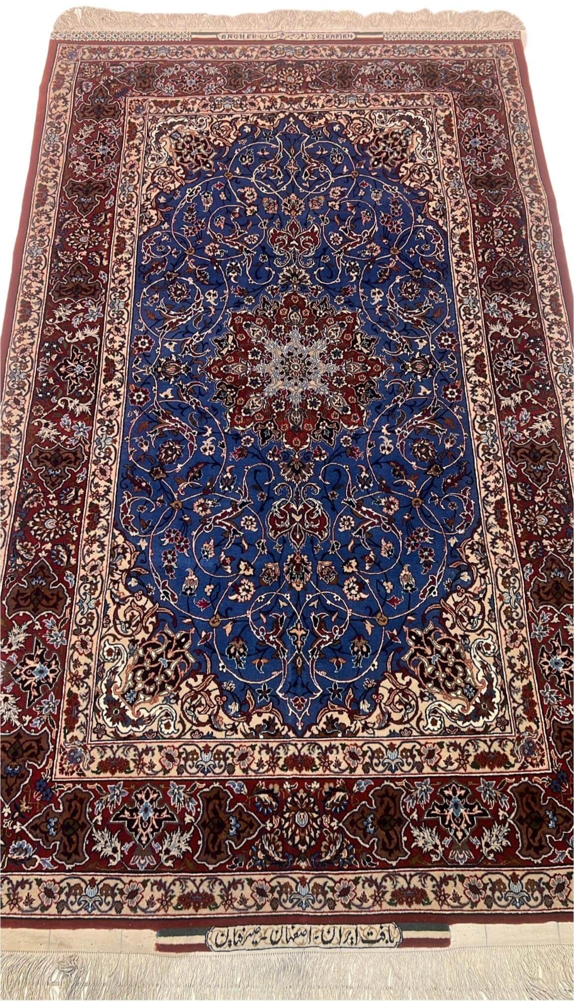 Front View: Elegant hand-knotted Persian rug in blue and red tones by Master Bagher Seirafian.
