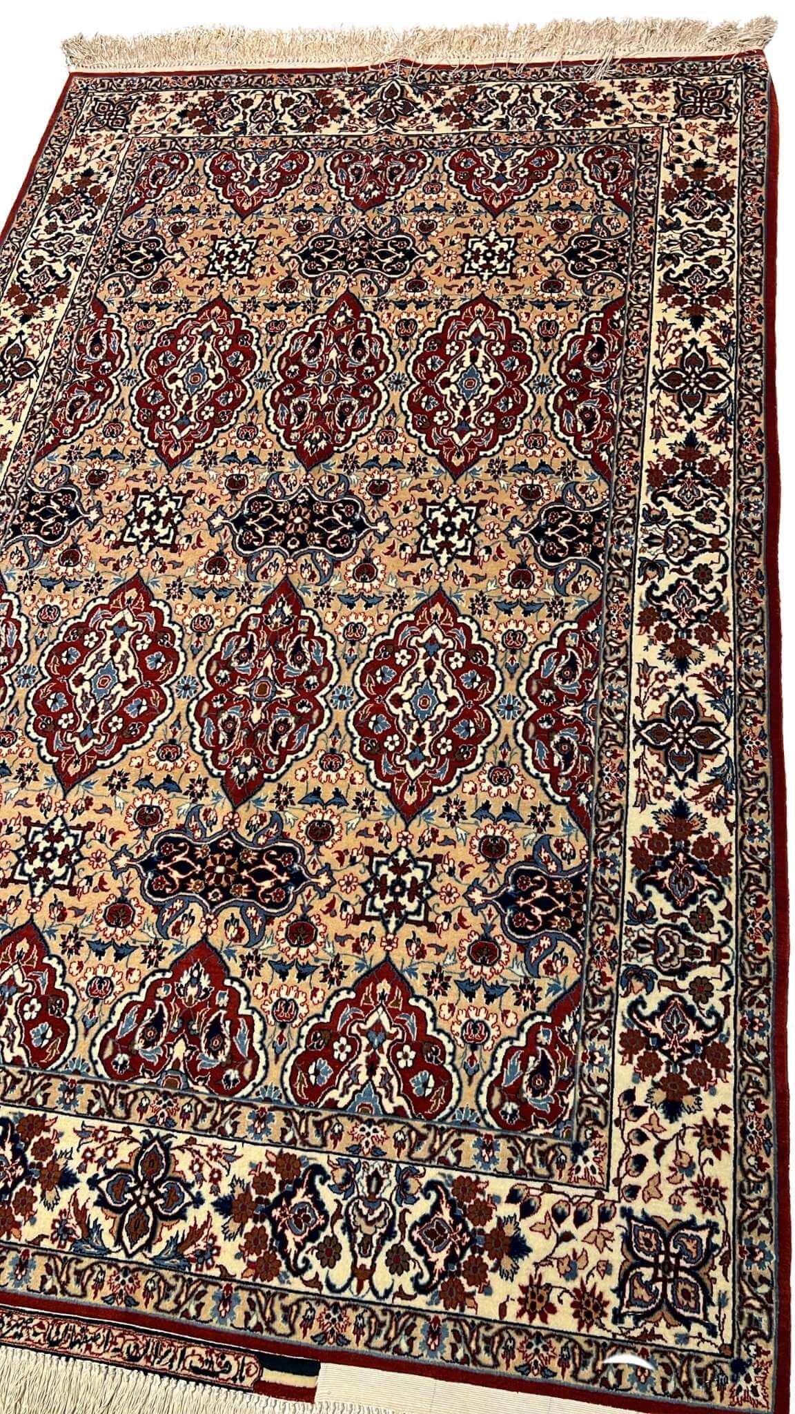 "40-year-old Persian rug by Master Ahmad Seirafian, featuring a luxurious blend of wool and silk in vibrant natural colors."

