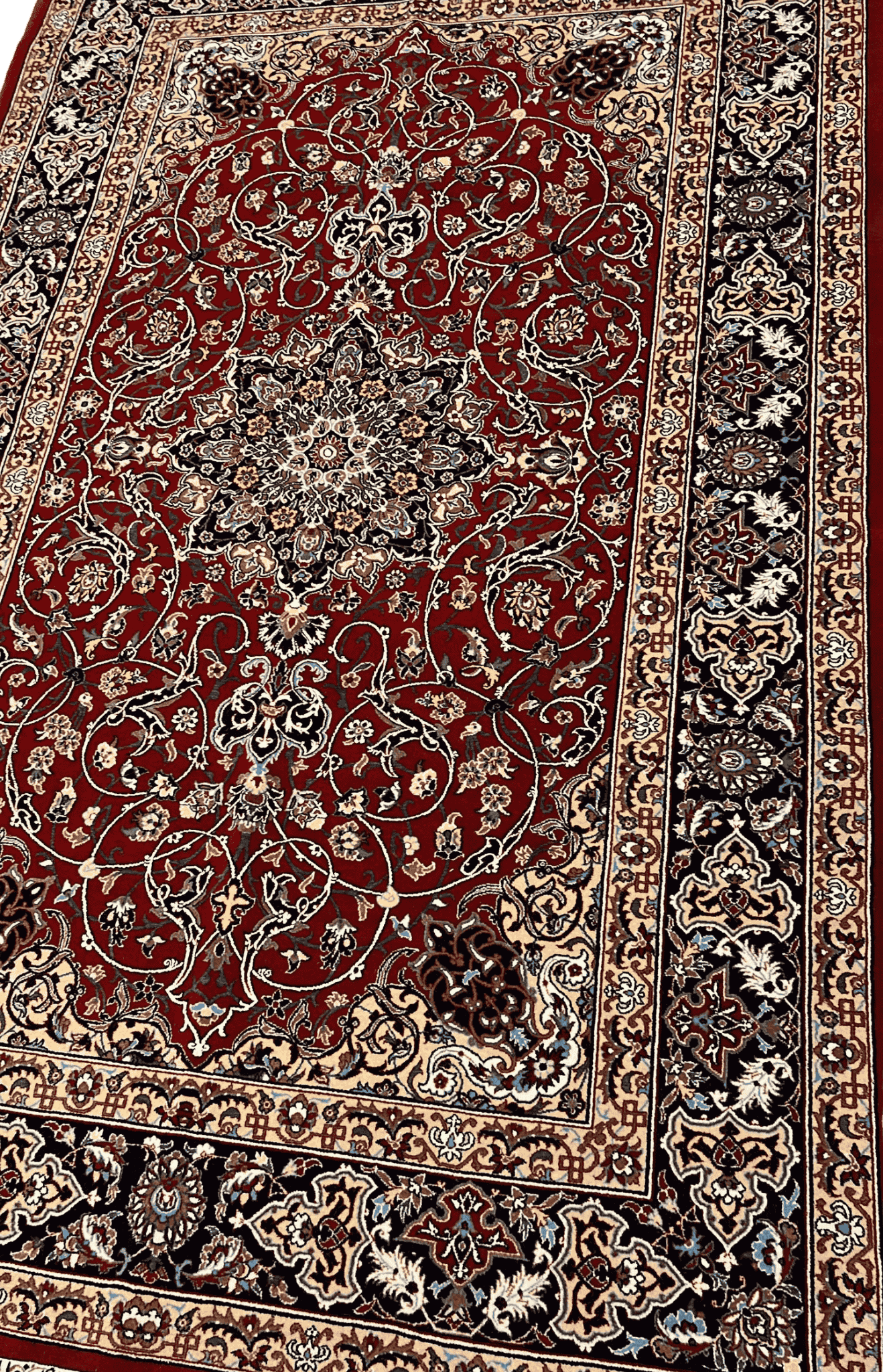 "Angled view of a luxurious Seirafian Persian rug, featuring a detailed medallion pattern with high knot density, handwoven from silk and wool in Isfahan."

