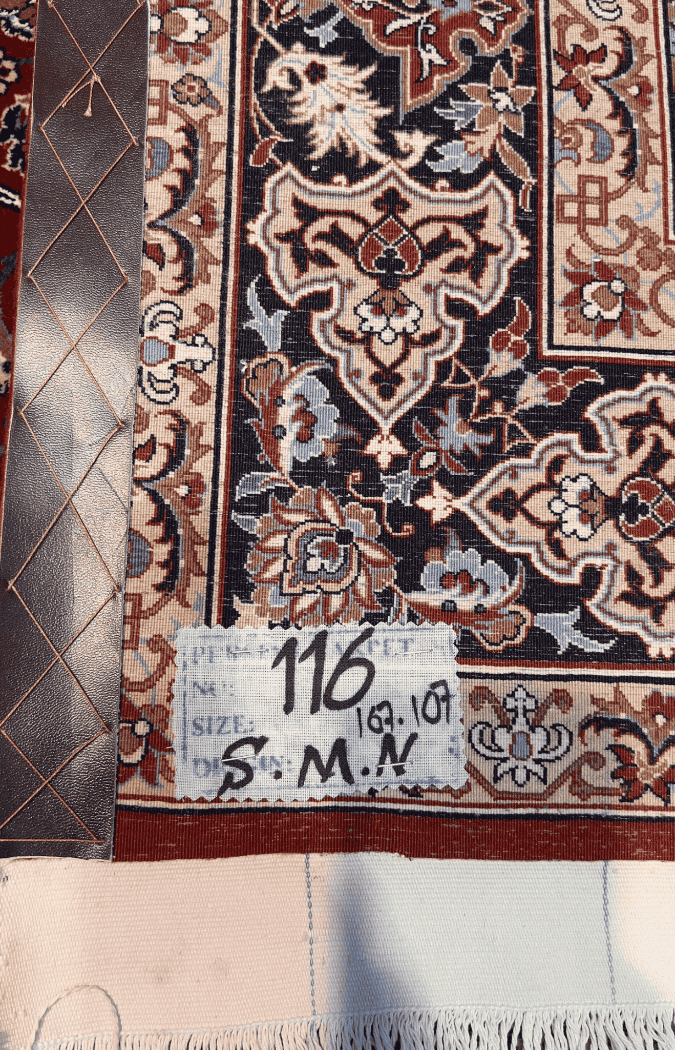 "Backside of a Seirafian Persian rug, showing the fine knot structure and craftsmanship, with silk warp and wool pile, handwoven in Isfahan."

