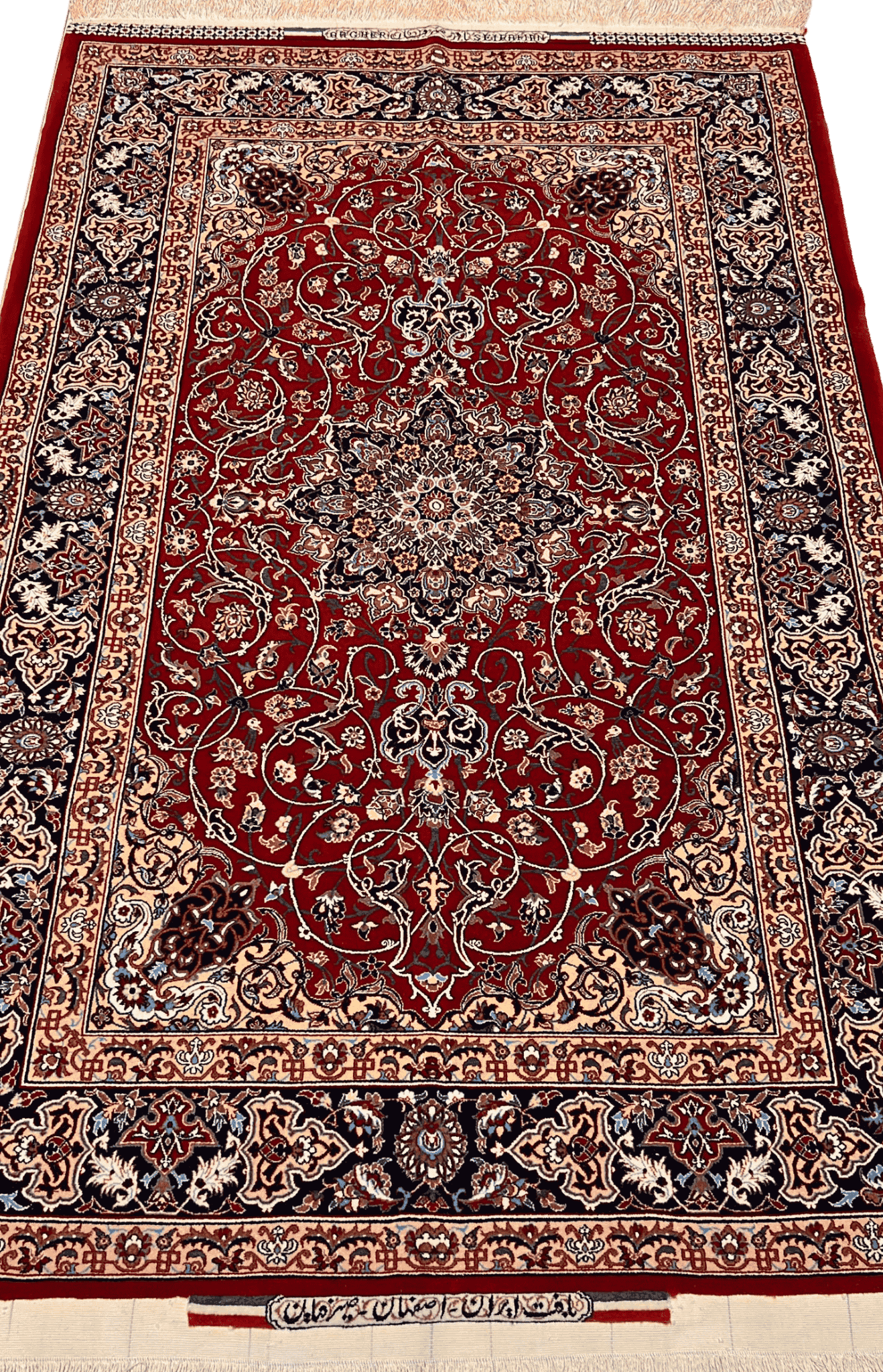 "Hand-knotted Seirafian Persian rug with red medallion design, made from silk and wool, measuring 5.7x3.5 ft, crafted in Isfahan by master weaver Bagher Seirafian."

