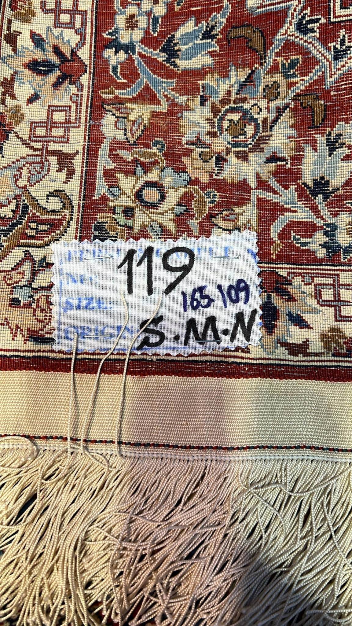 "Backside of a Seirafian Persian rug, highlighting the fine hand-knotted craftsmanship and high knot density for durability and quality."

