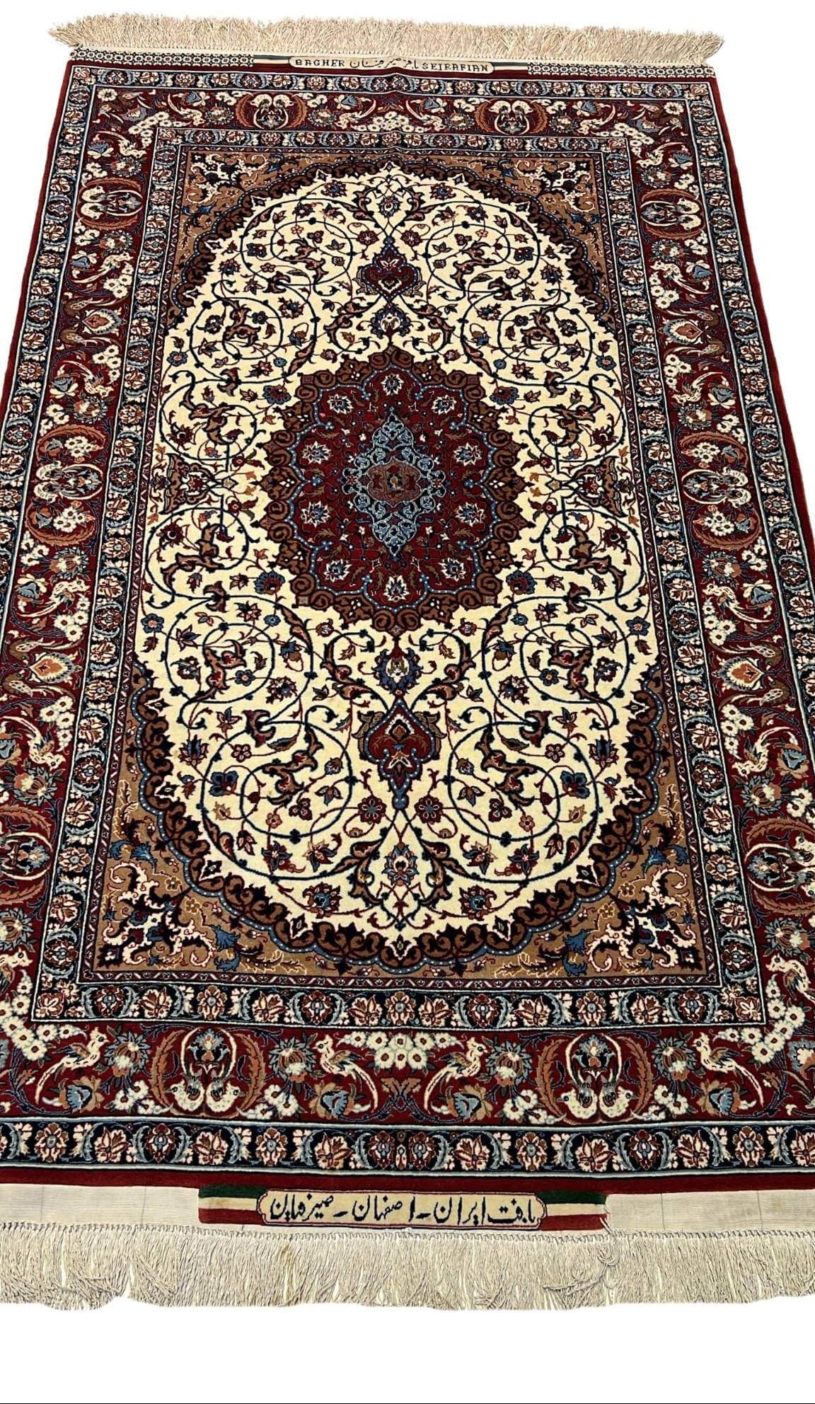"Seirafian Isfahan small rug, hand-knotted with wool and silk, featuring intricate Persian floral patterns crafted by Master Bagher Seirafian."

