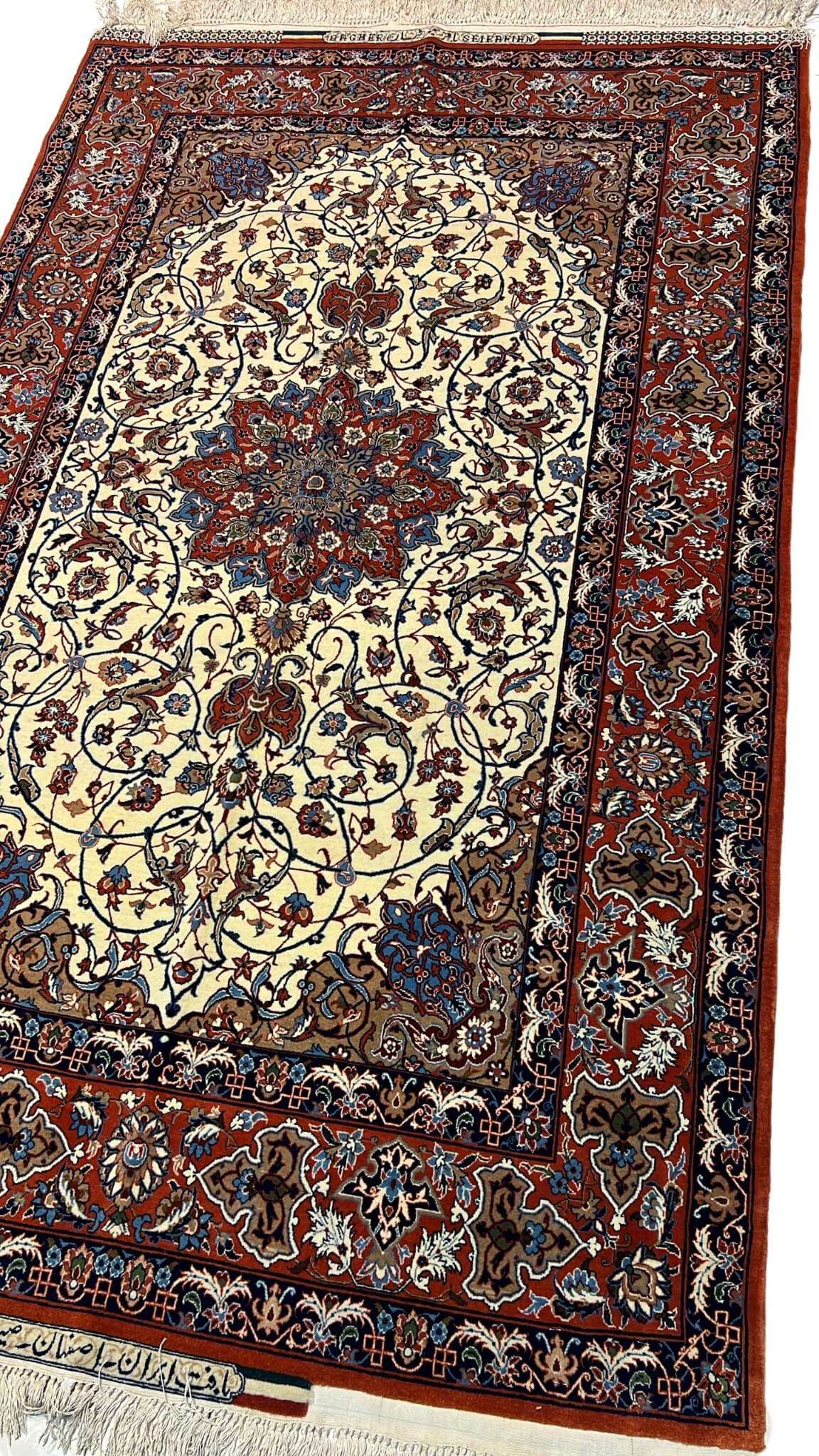 "Close-up of a luxurious Seirafian rug showcasing detailed knotting and natural dyed colors."


