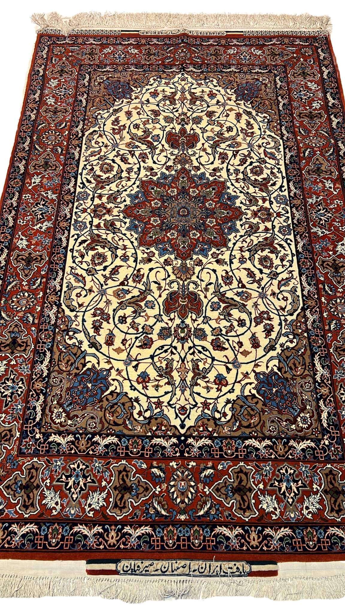 "Hand-knotted Seirafian Persian rug with floral designs, crafted in Isfahan using wool and silk."

